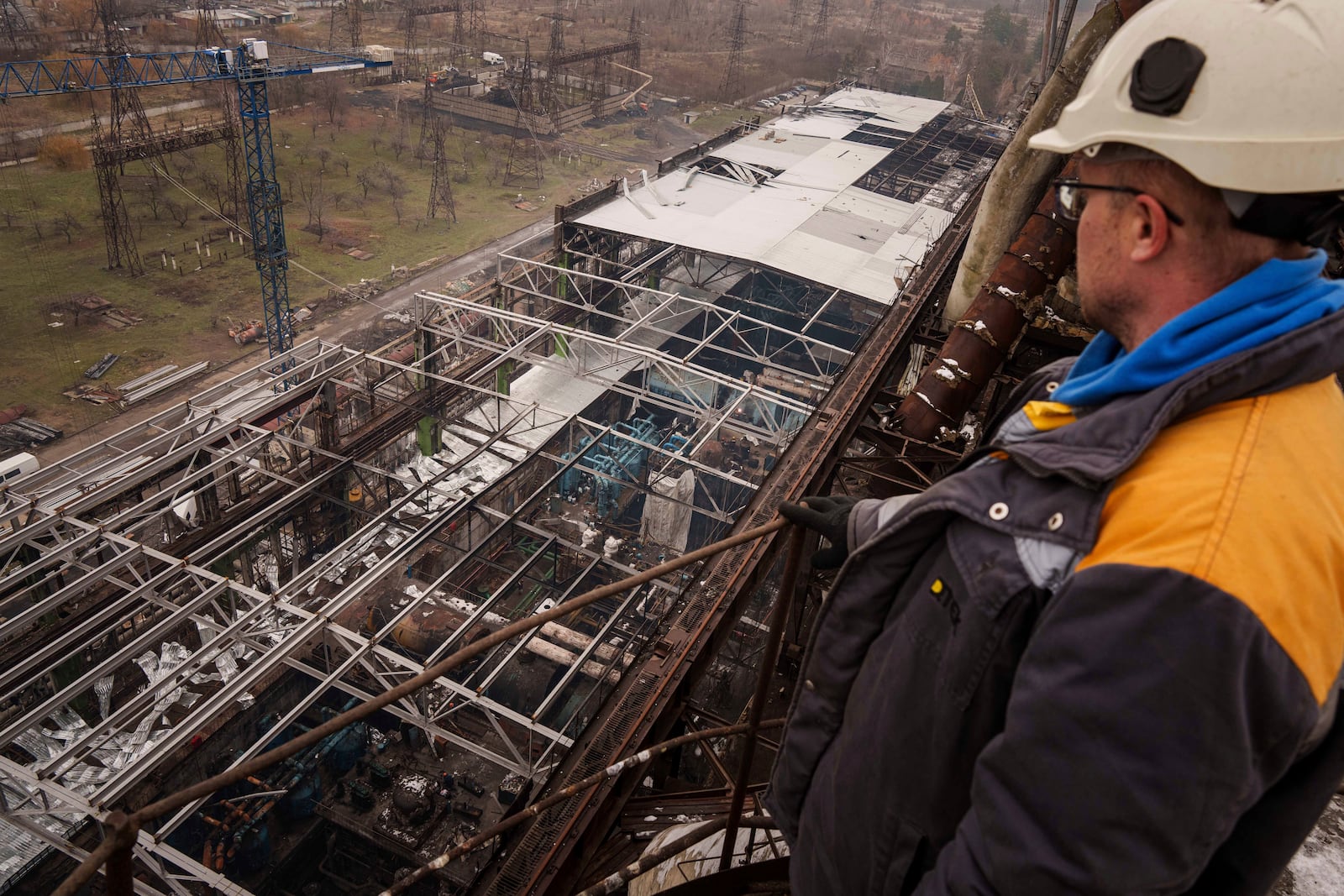 A worker looks on a production hall after a recent Russian missile attack at DTEK's power plant in Ukraine, Nov. 28, 2024. (AP Photo/Evgeniy Maloletka)