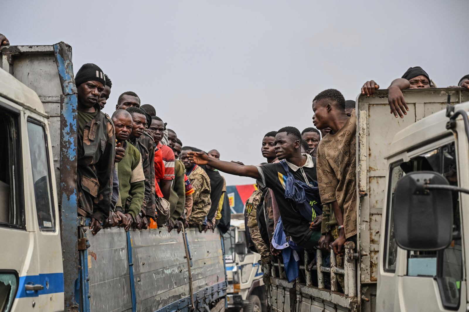 M23 rebels escort government soldiers and police who surrendered to an undisclosed location in Goma, Democratic republic of the Congo, Thursday, Jan. 30, 2025. (AP Photo/Moses Sawasawa)