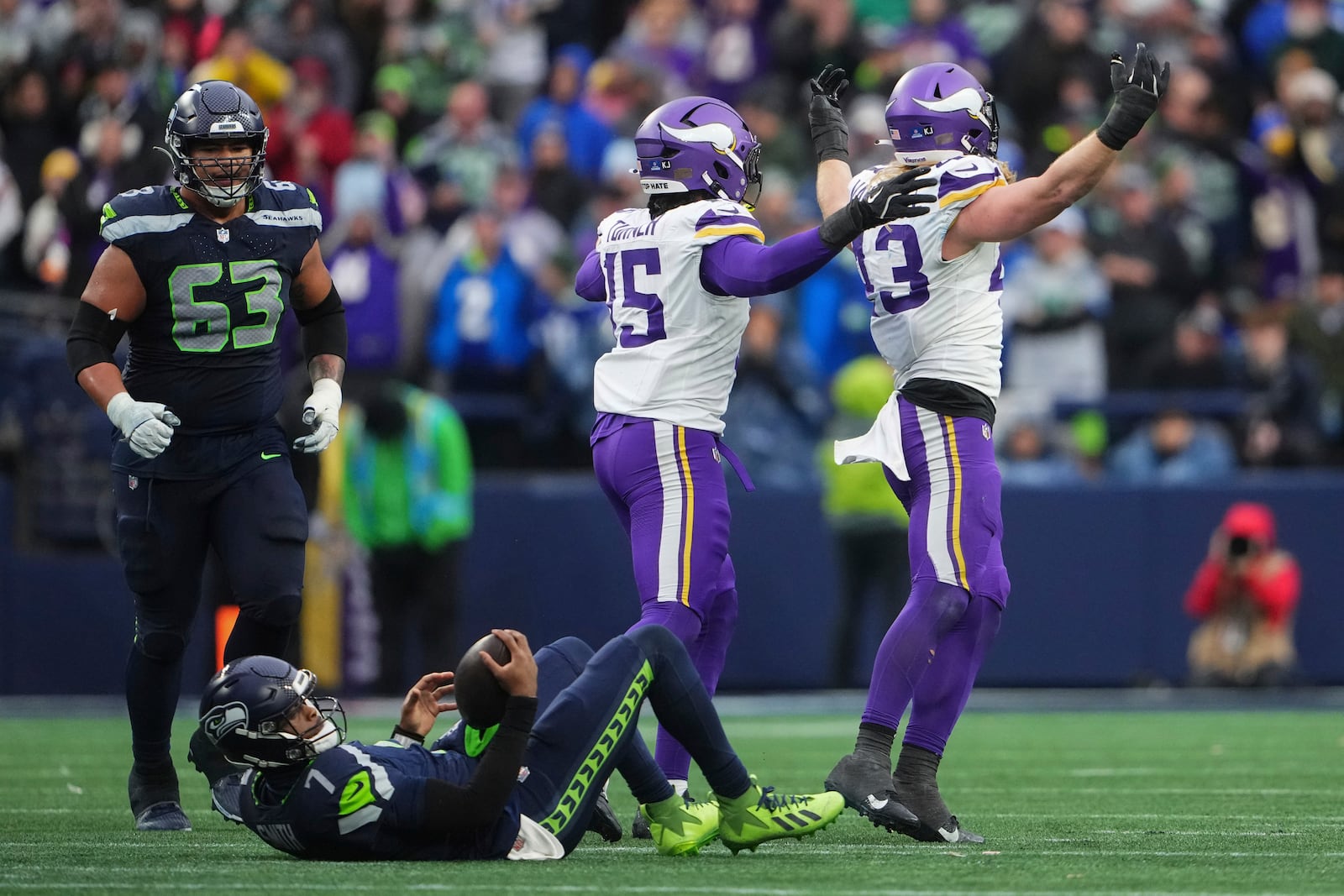 Minnesota Vikings linebacker Andrew Van Ginkel (43), right, celebrates after sacking Seattle Seahawks quarterback Geno Smith (7) during the second half of an NFL football game, Sunday, Dec. 22, 2024, in Seattle. (AP Photo/Lindsey Wasson)