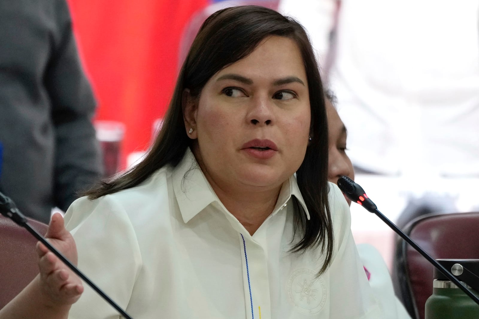 Philippine Vice President Sara Duterte gestures as she attends a hearing at the House of Representative in Quezon City, Philippines on Monday Nov. 25, 2024. (AP Photo/Aaron Favila)