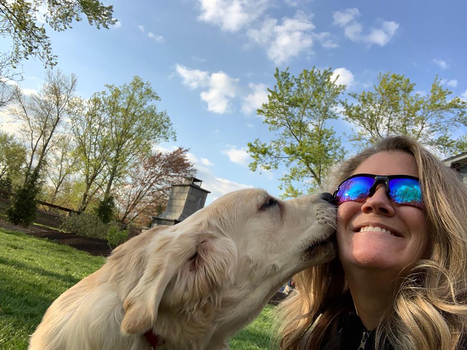 Miller in her back yard in Centerville with her foster service dog, Cesto. She says all dogs, from service dogs to the family pet, deserve safe dog park experiences and that these parks are also great boosts to the local economies.