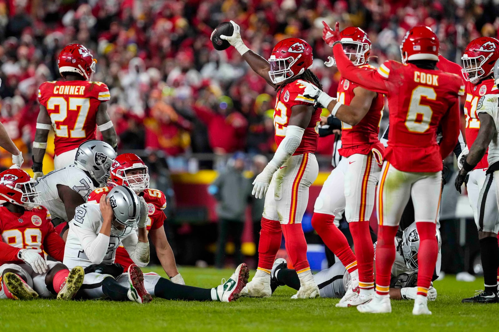 Kansas City Chiefs linebacker Nick Bolton (32) holds the recovery ball after a fumble by the Las Vegas Raiders during the second half of an NFL football game in Kansas City, Mo., Friday, Nov. 29, 2024. (AP Photo/Ed Zurga)