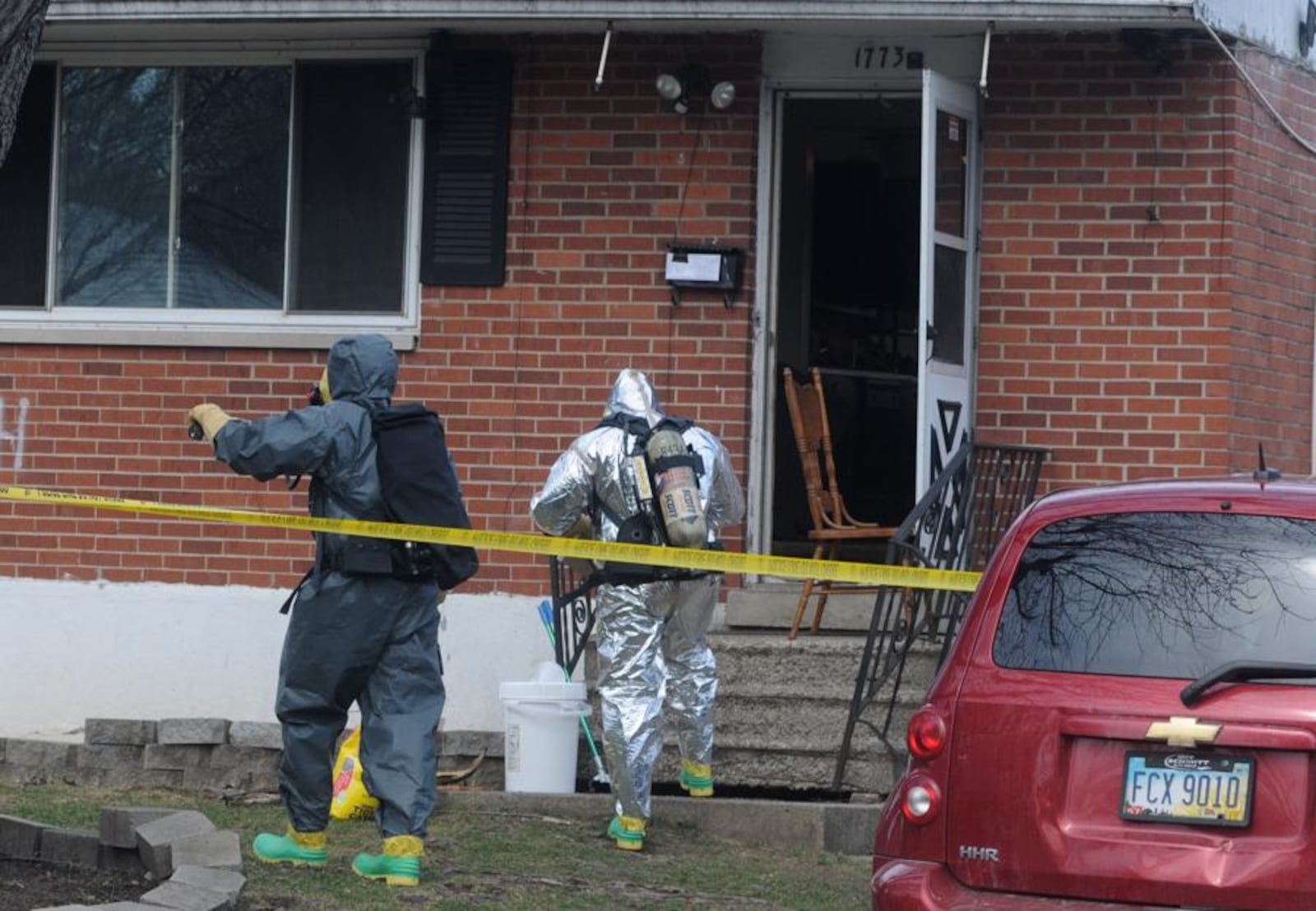 A small brick home was surrounded by yellow crime scene tape as Dayton police and fire personnel investigated and dismantled a suspected meth lab on Eric Drive on March 8, 2016. (Marshall Gorby/Staff)