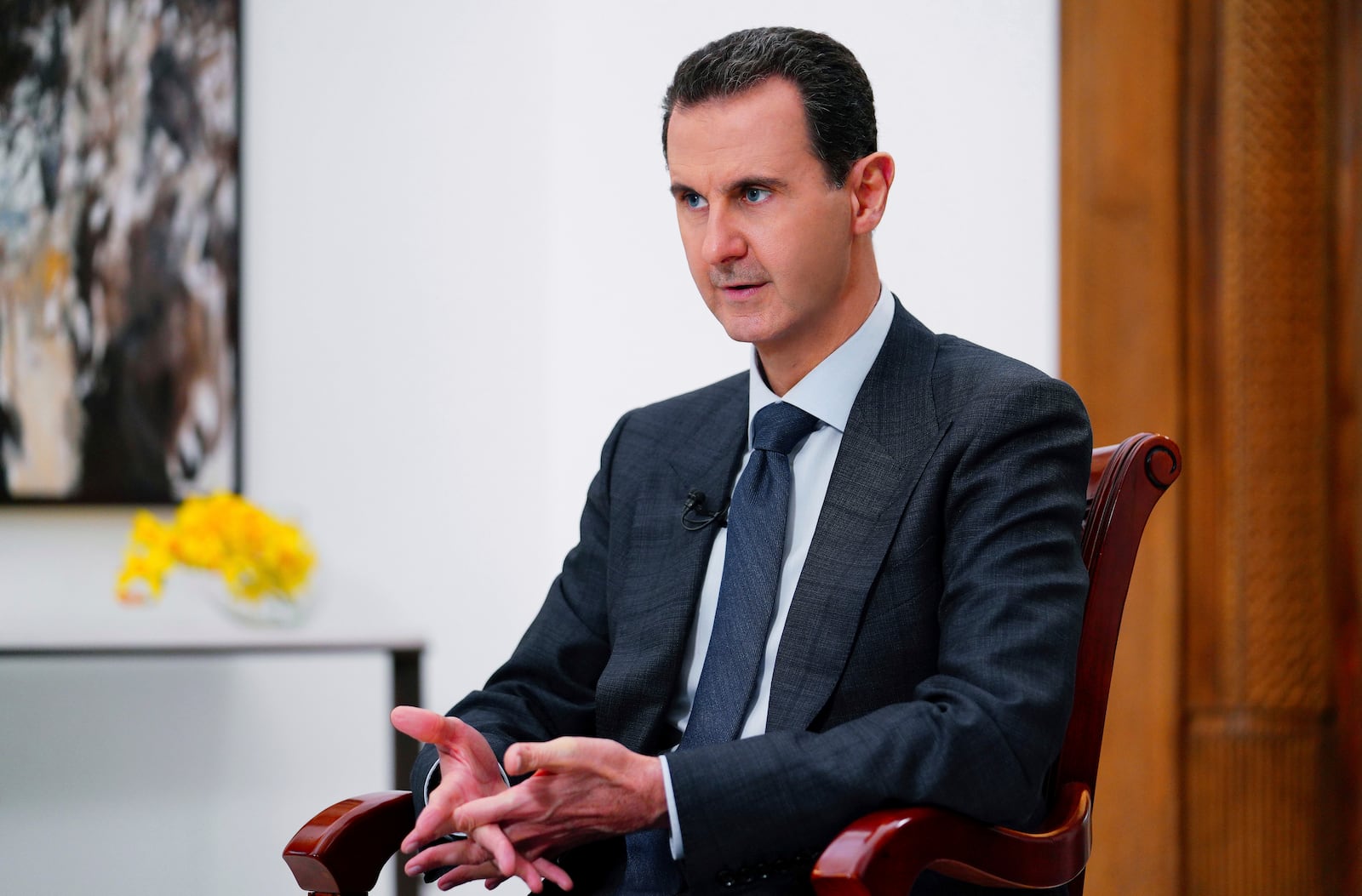 FILE - In this photo released Nov. 9, 2019, by the official news agency SANA, then-President Bashar Assad speaks in Damascus, Syria. (SANA FILE via AP, File)