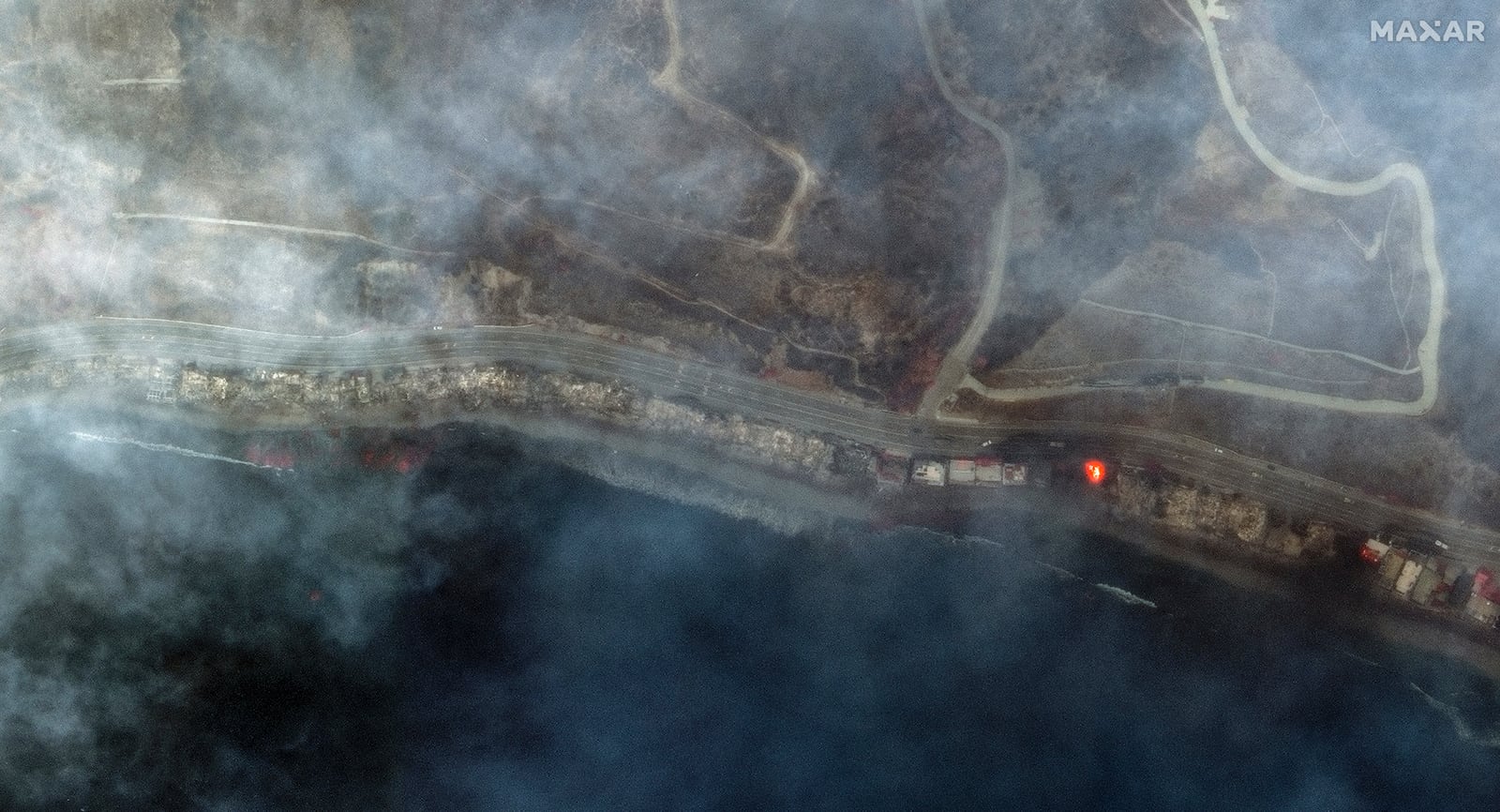 This infrared satellite image provided by Maxar Technologies shows burned structures and active fire burning from the Palisades Fire in Tuna Canyon Wednesday, Jan. 8, 2025, in Los Angeles. (Maxar Technologies via AP)