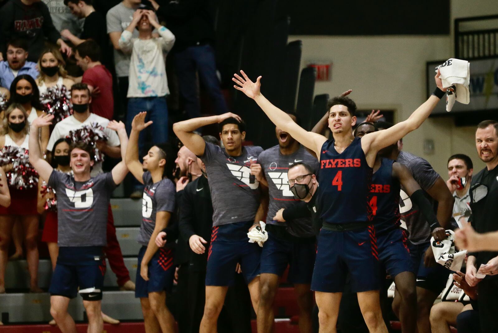 Dayton's Koby Brea, right, reacts after a dunk by Toumani Camara in the first half against Saint Joseph’s on Saturday, Feb 19, 2022, at Hagan Arena in Philadelphia, Pa. David Jablonski/Staff