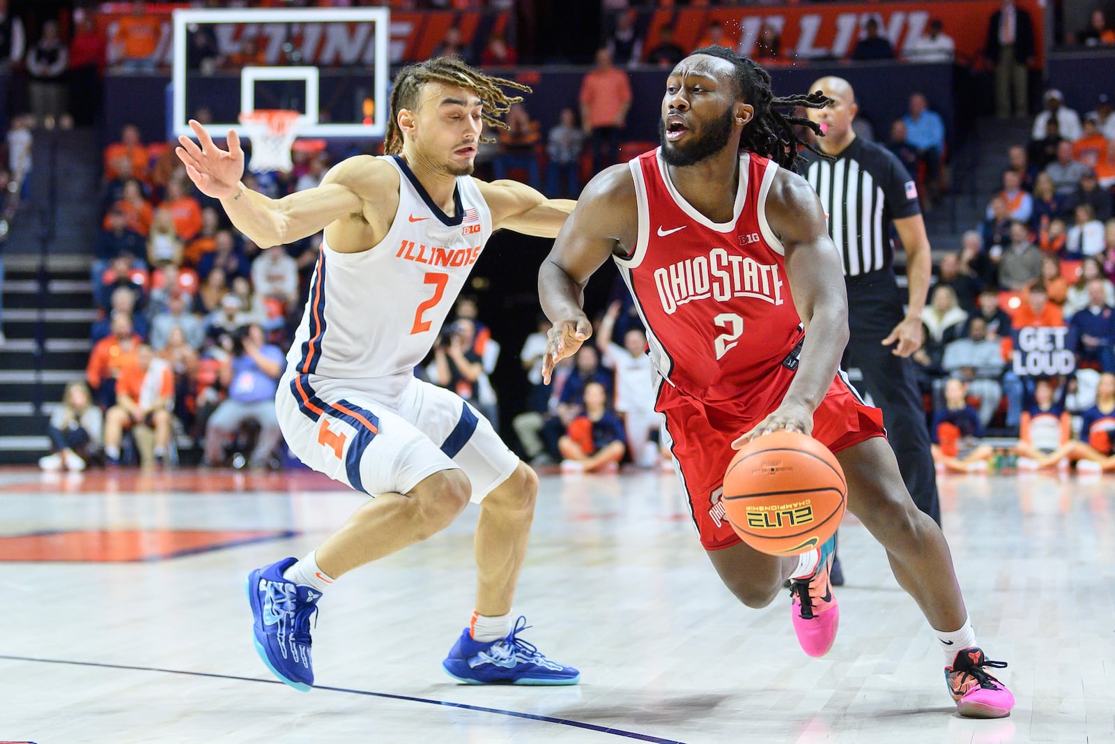 Ohio's State's Bruce Thornton, right, drives to the basket as Illinois' Dra Gibbs-Lawhorn, left, defends during the second half of an NCAA college basketball game Sunday, Feb. 2, 2025, in Champaign, Ill. (AP Photo/Craig Pessman)