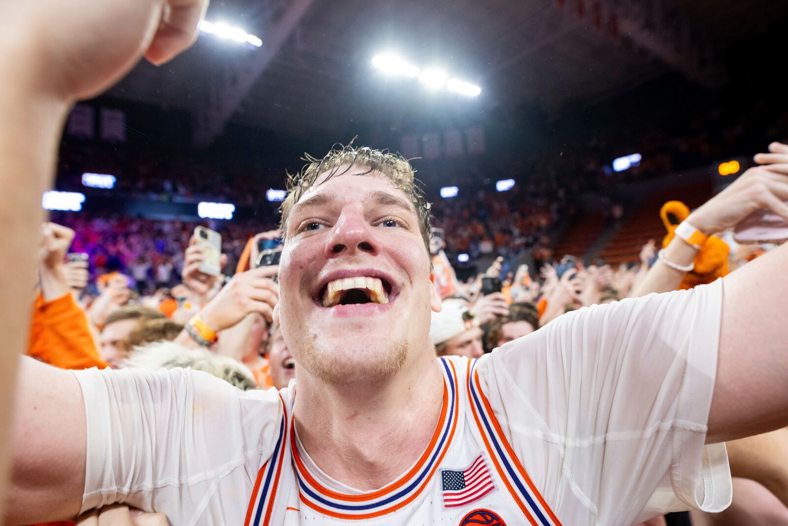 Clemson center Viktor Lakhin (0) celebrates with students after defeating Duke in an NCAA college basketball game on Saturday, Feb. 8, 2025, in Clemson, S.C. (AP Photo/Scott Kinser)