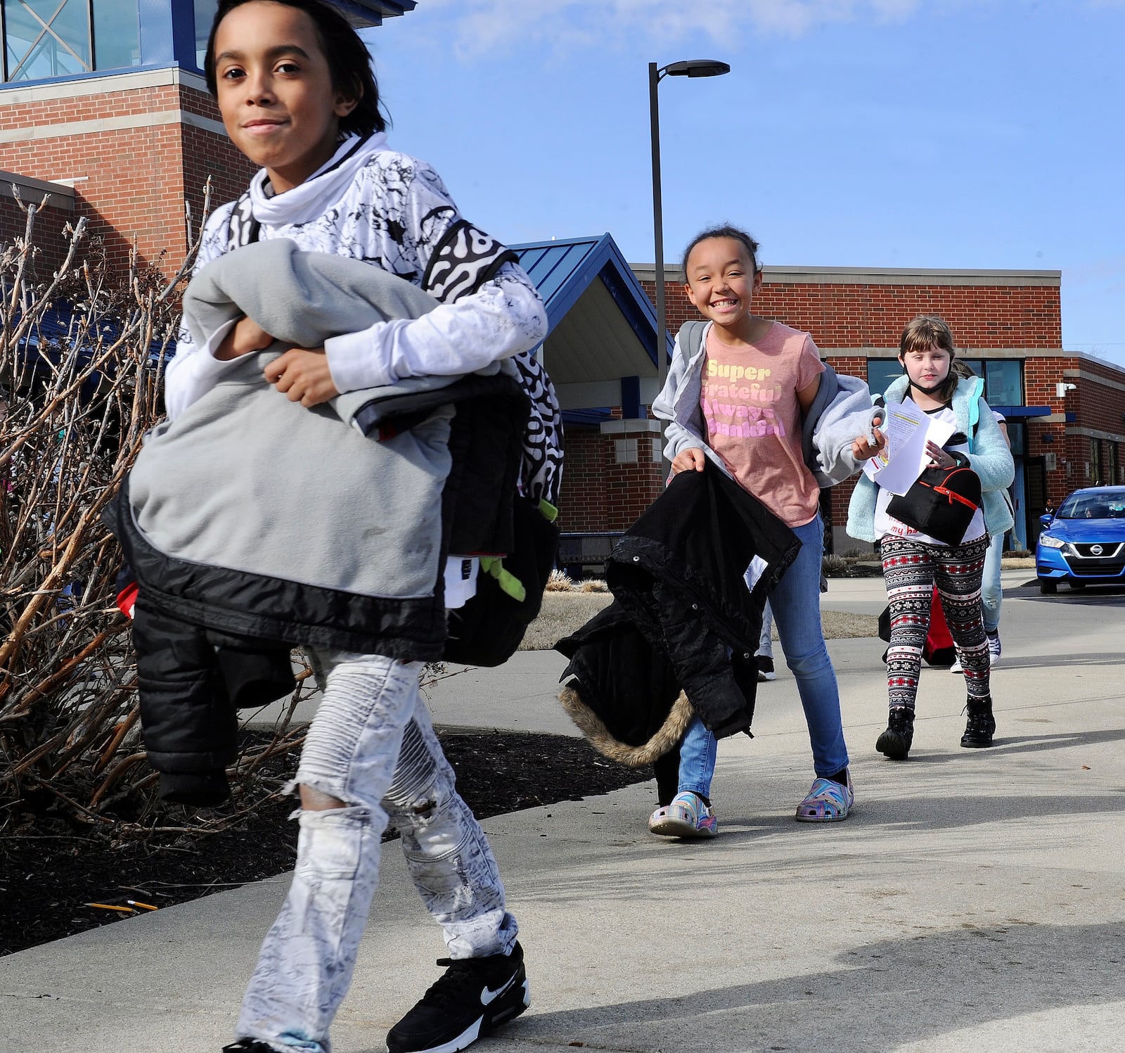 Huber Heights students get on the bus at Valley Forge Elementary School on Thursday. Huber Heights is one of the local districts that saw an increase in its chronic absenteeism rate last school year compared to pre-pandemic levels. Marshall Gorby / Staff