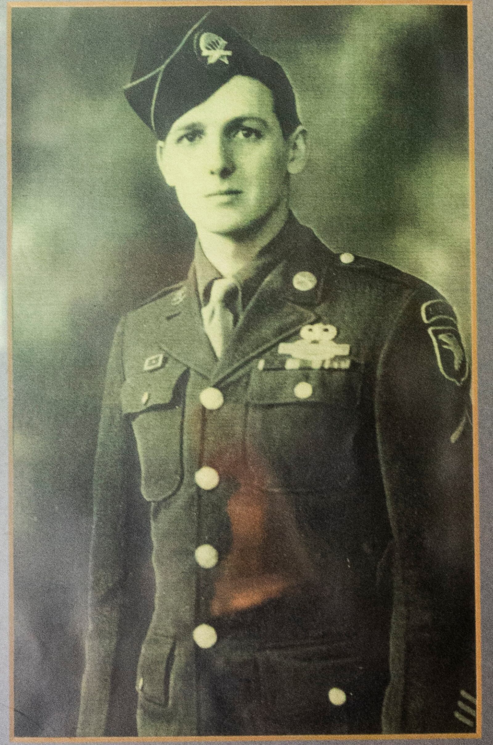 A photo of then Private Jim “Pee Wee” Martin, hangs on the wall inside his Xenia, Ohio, home. Martin served as a paratrooper assigned to 101st Airborne Division, 506th Infantry Regiment, G Company, out of Fort Campbell, Kentucky. U.S. AIR FORCE PHOTO/WESLEY FARNSWORTH