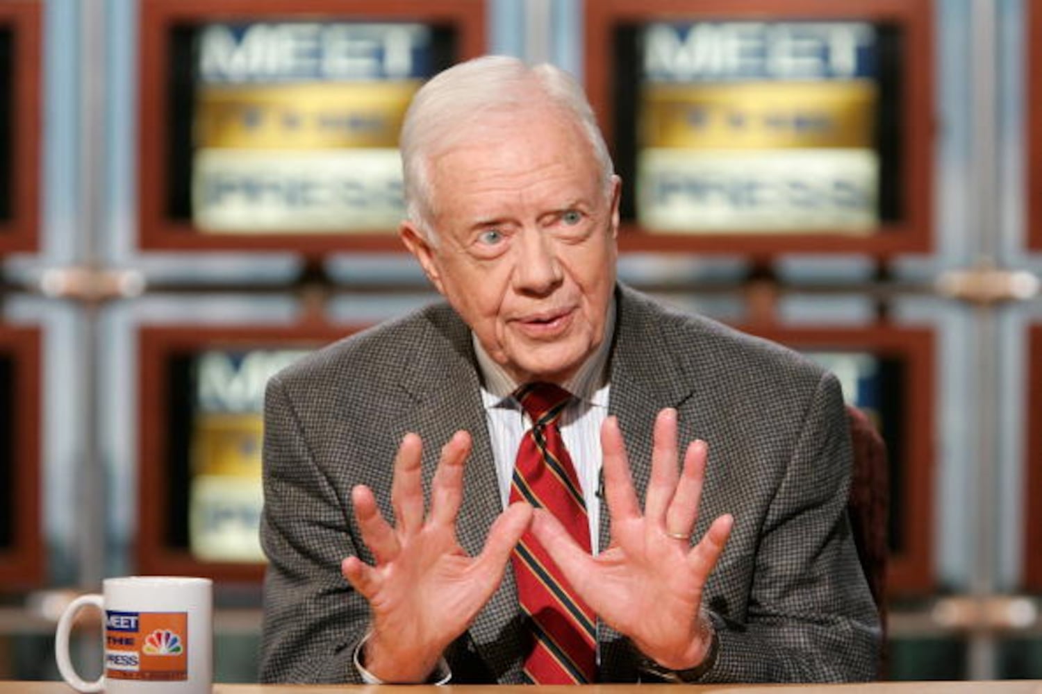 Former President Jimmy Carter shakes hands with every passenger on flight