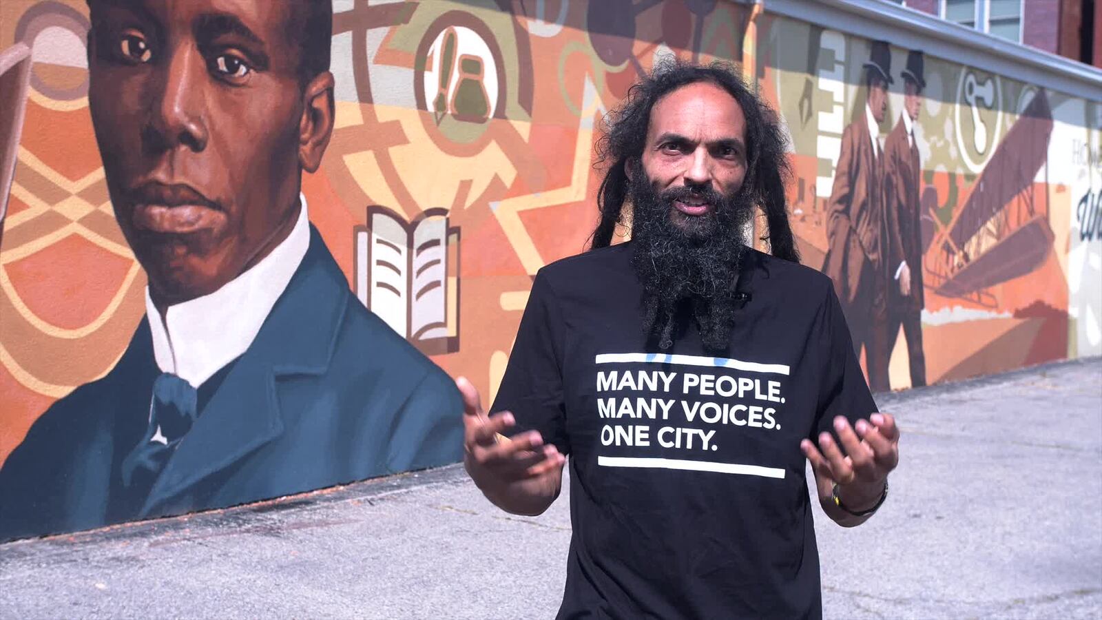 Amaha Sellassie  in the Human Relations Council's Many People. Many Voices. One City. T-shirt