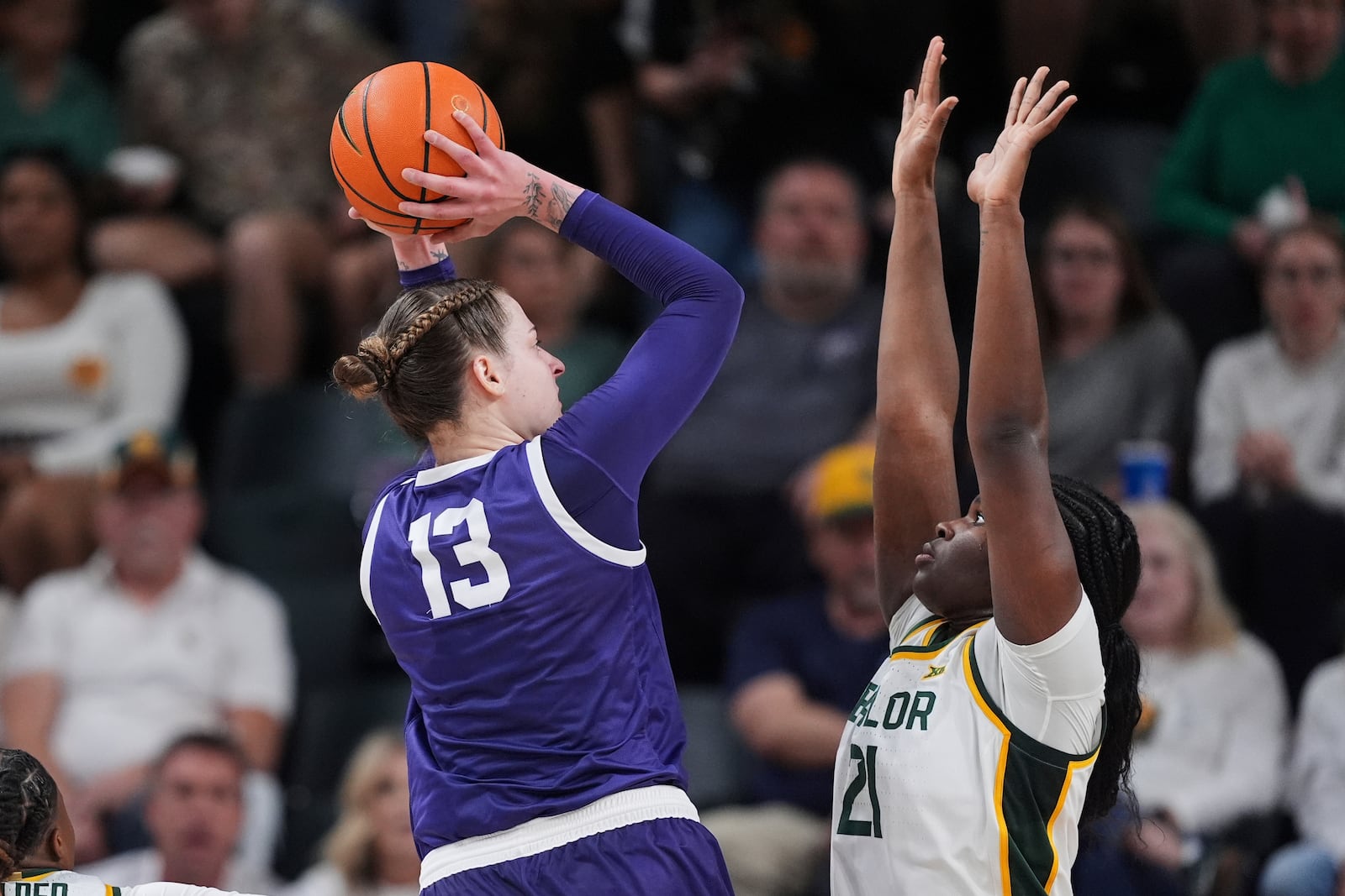 TCU center Sedona Prince (13) shoots over Baylor center Aaronette Vonleh (21) in the first half of an NCAA college basketball game in Waco, Texas, Sunday, March 2, 2025. (AP Photo/Tony Gutierrez)