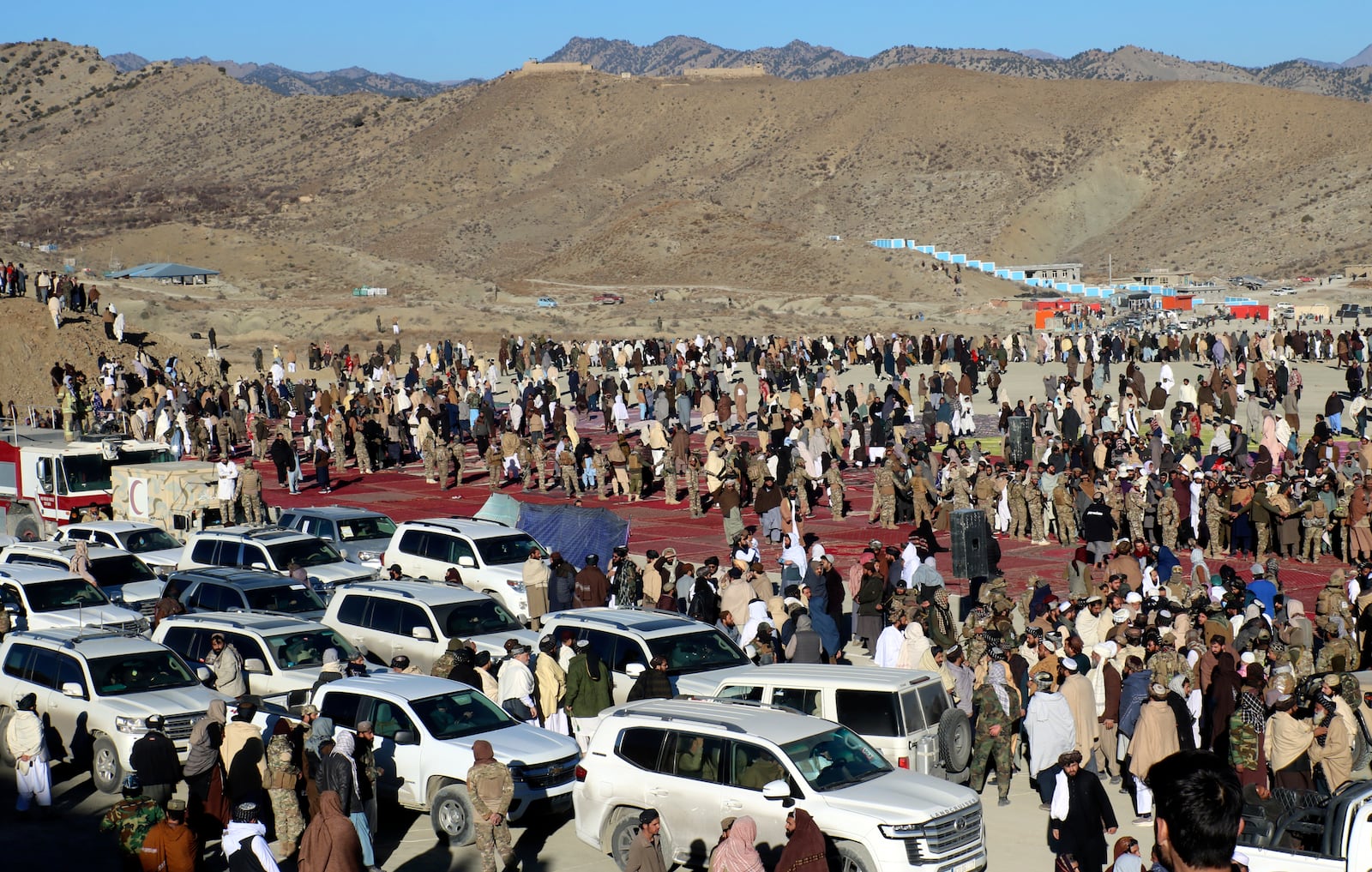 People attend the funeral prayer of Khalil Haqqani, the minister for refugees and repatriation, during his funeral procession in eastern Paktia province, Afghanistan, Thursday, Dec. 12, 2024. (AP Photo/Saifullah Zahir)