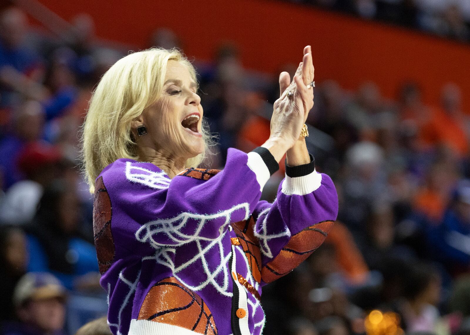 LSU head coach Kim Mulkey celebrates a point during the first half an NCAA college basketball game against Florida, Sunday, Jan. 19, 2025, in Gainesville, Fla. (AP Photo/Alan Youngblood)