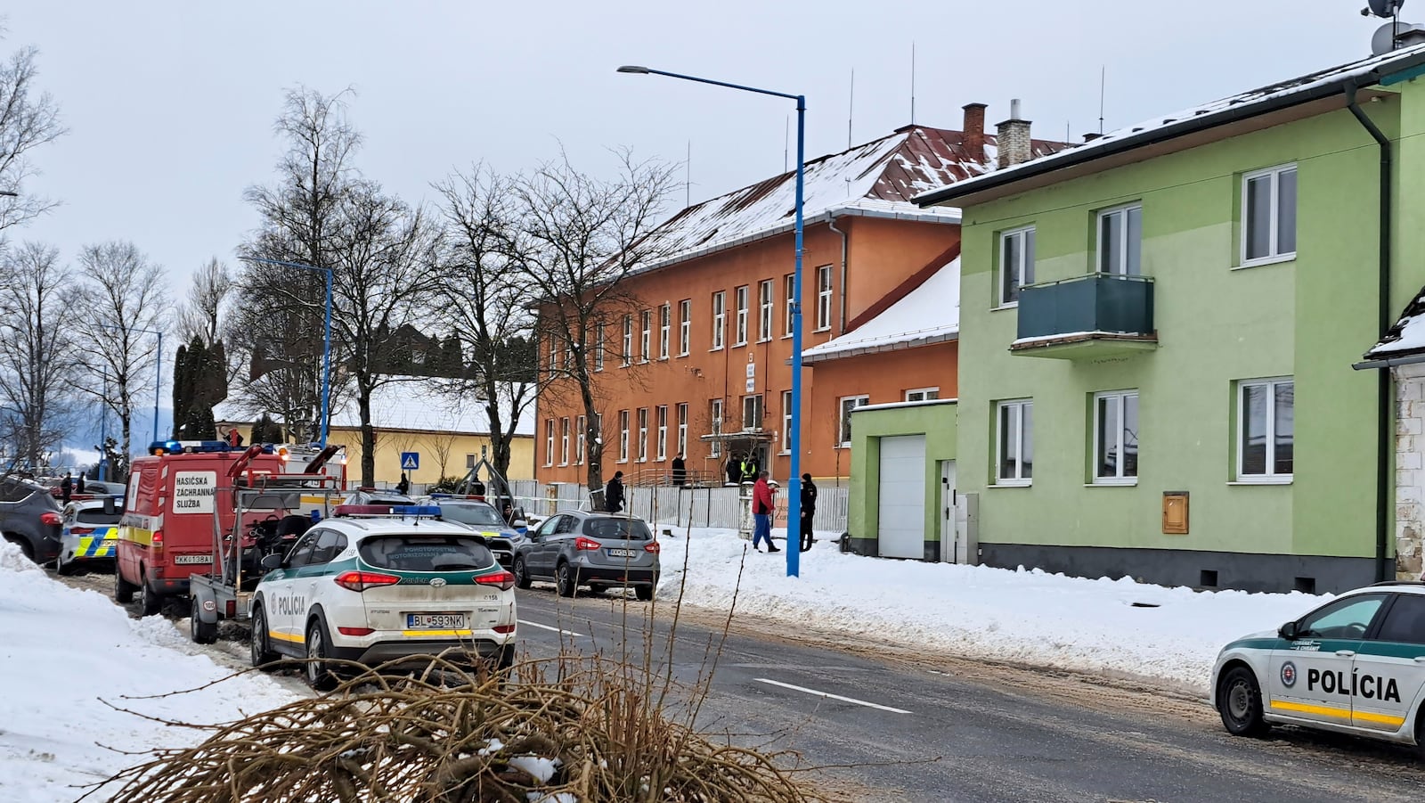 Emergency services atthe scene where two people were fatally stabbed at a secondary grammar school, center, in the town of Spisska Stara Ves (Presov region), eastern Slovakia, Thursday, Jan. 16, 2025. (Adriana Hudecova/TASR via AP)