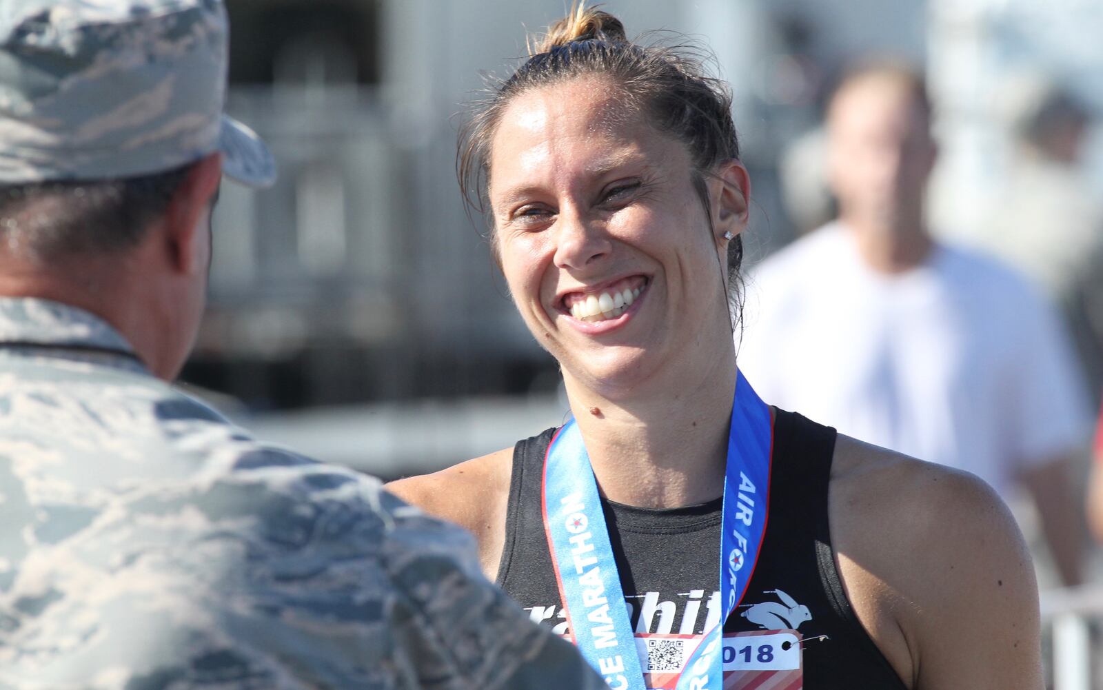 Sarah Bishop accepts her medal after winning the 22nd annual Air Force Marathon on Saturday, Sept. 15, 2018, at Wright-Patterson Air Force Base. David Jablonski/Staff