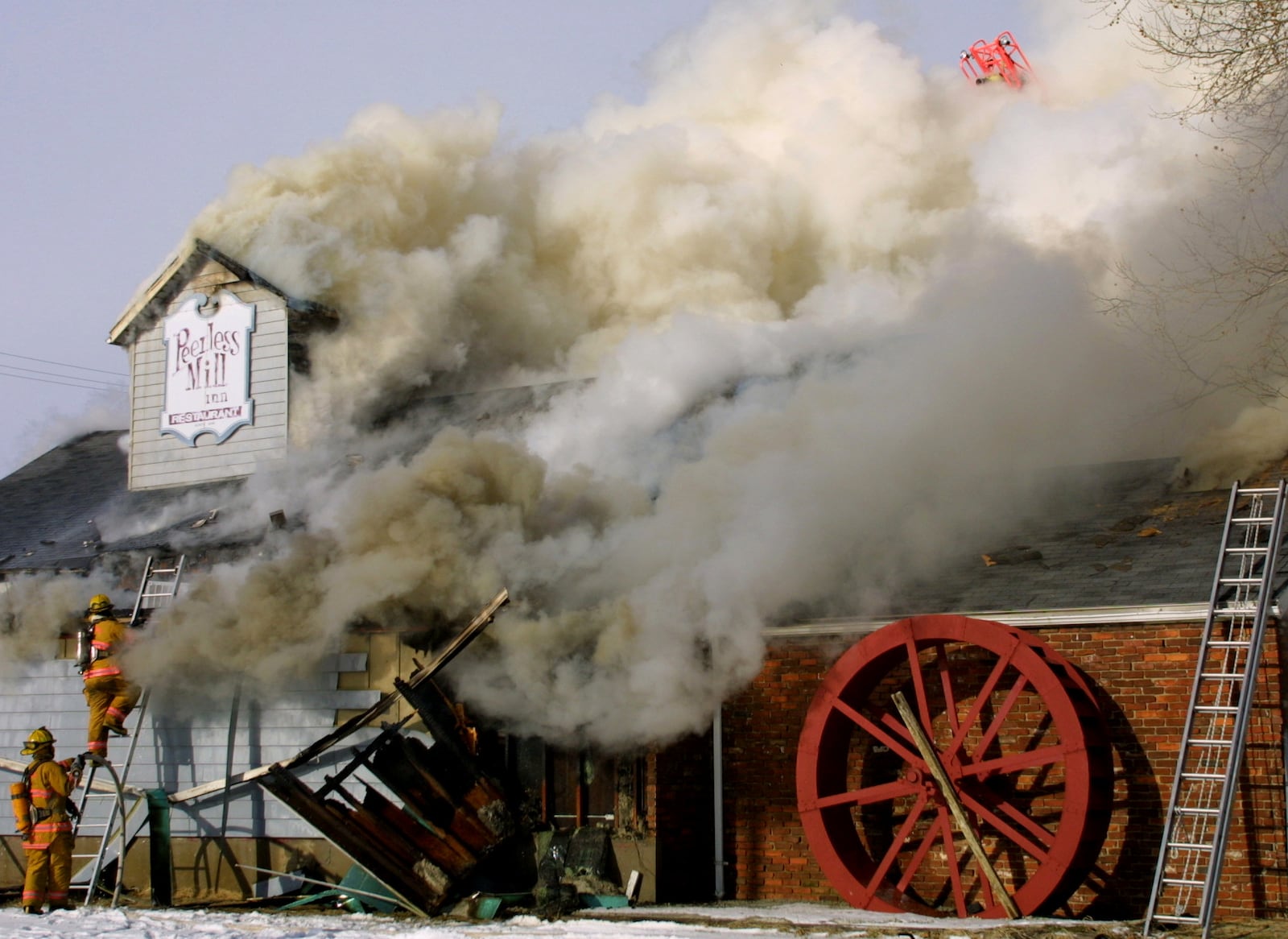 Miamisburg fireman fight a blaze at the Peerless Mill Inn in 2003. STAFF FILE PHOTO