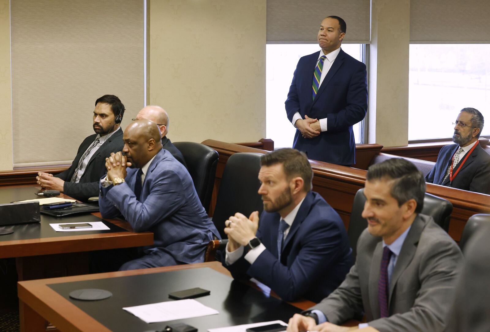 Defense attorney Lawrence Hawkins III, standing in back, will join the team of David Washington and Jeremy Evans to represent Gurpreet Singh in a new trial scheduled for April 29, 2024. Singh appeared in court Friday, Feb. 10, 2023 in Judge Gregory Howard's courtroom in Butler County Common Pleas Court in Hamilton. Singh is charged in a quadruple homicide of his wife and three other family members in April 2019. Singh's first trial resulted in a hung jury.  NICK GRAHAM/STAFF