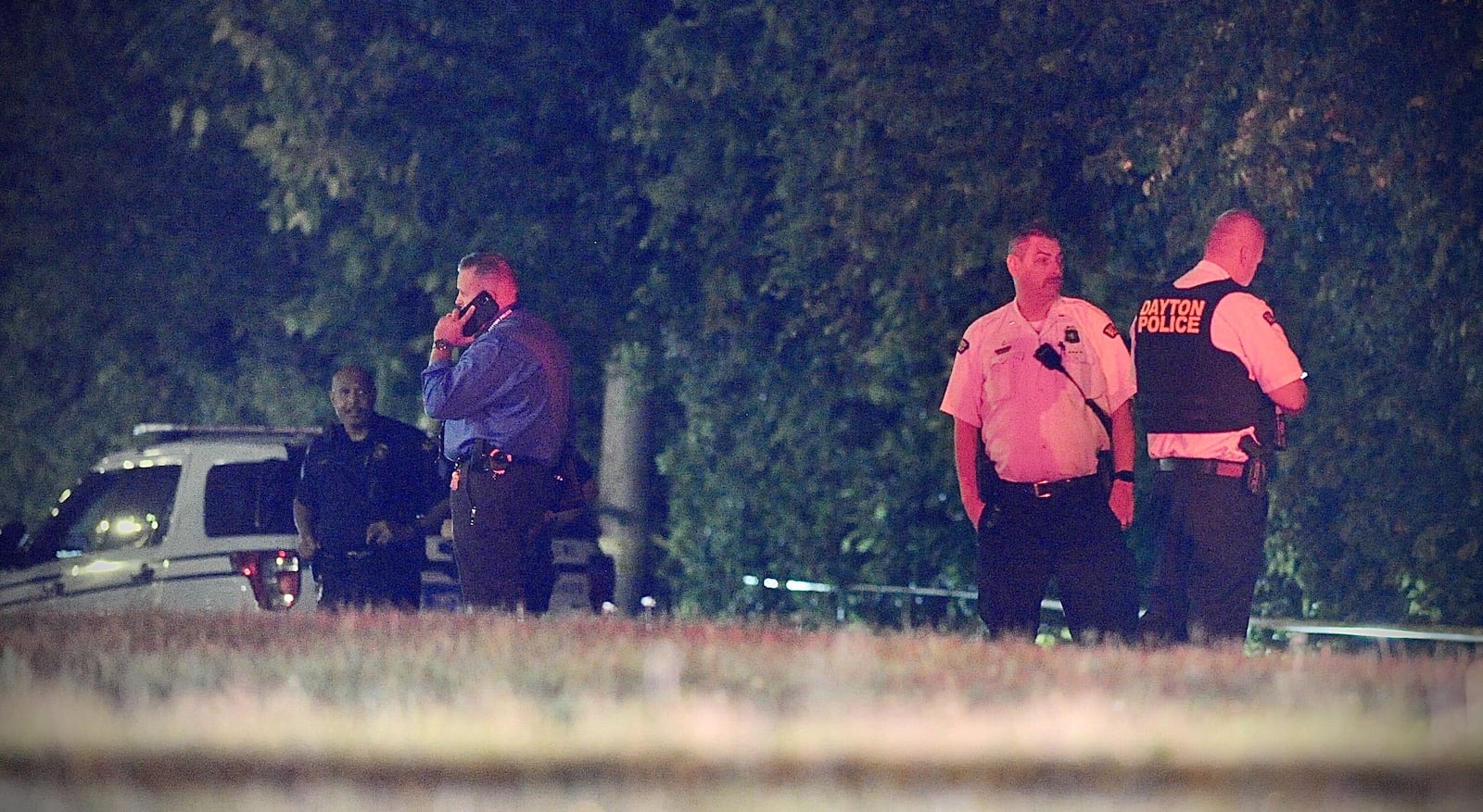 Police on scene on Ingram Street where a Dayton police officer and a suspect were shot. The officer is in stable condition but the suspect was critically wounded, according to the Dayton Police Department. MARSHALL GORBY \STAFF