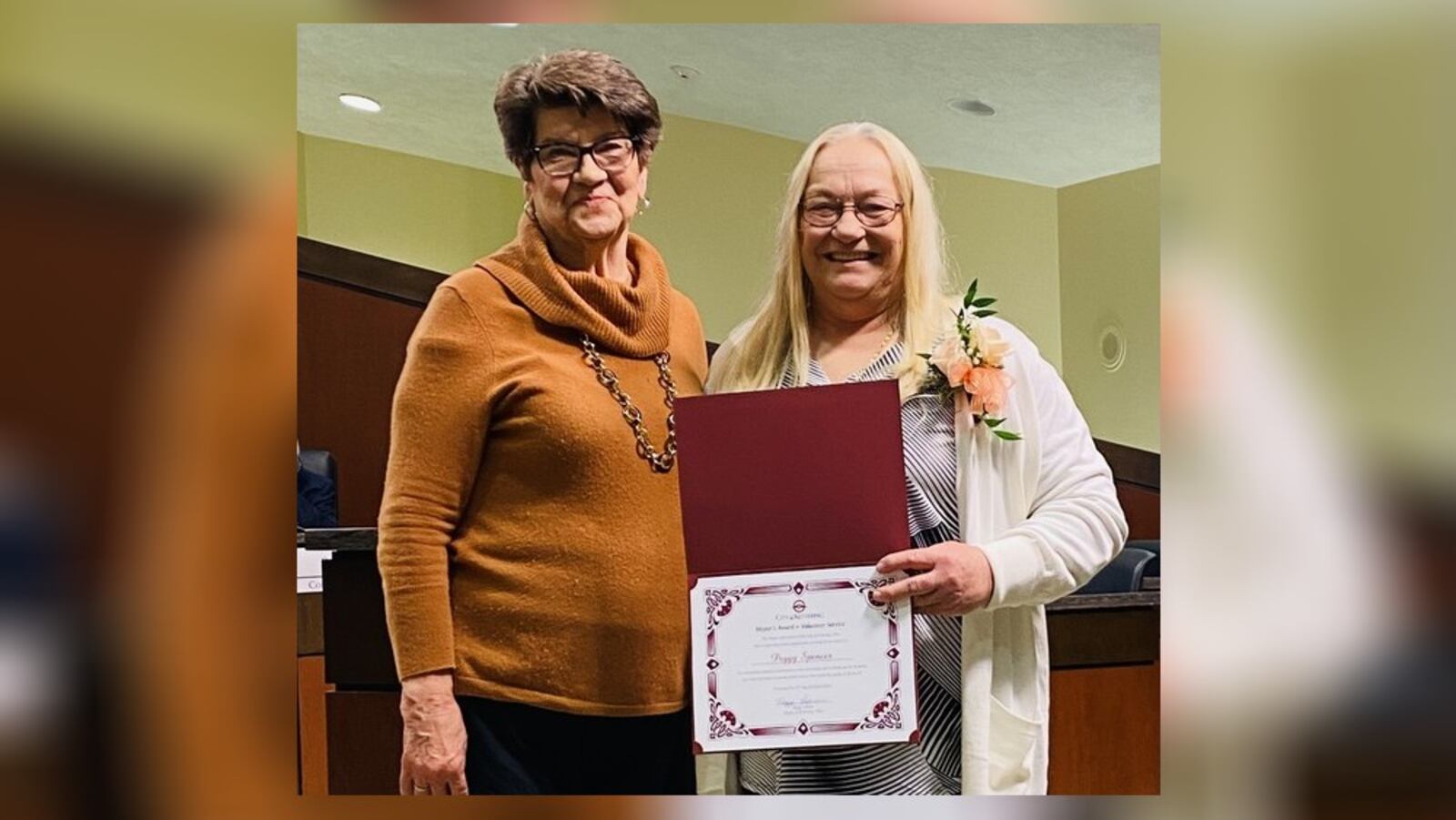 Peggy Spencer (right) was recently given the top Kettering adult award for volunteering by Mayor Peggy Lehner. Spencer is a longtime volunteer at Greenmont Elementary School. CONTRIBUTED