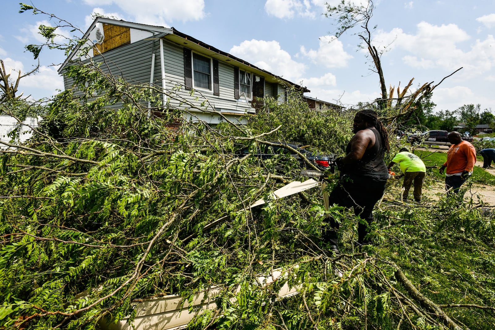 Houses and businesses in Trotwood were damage by tornadoes late Monday night, May 27. Many streets were blocked for downed trees, power lines and debris scattered through the neighborhoods. These homes were on Olive Tree Drive. NICK GRAHAM/STAFF