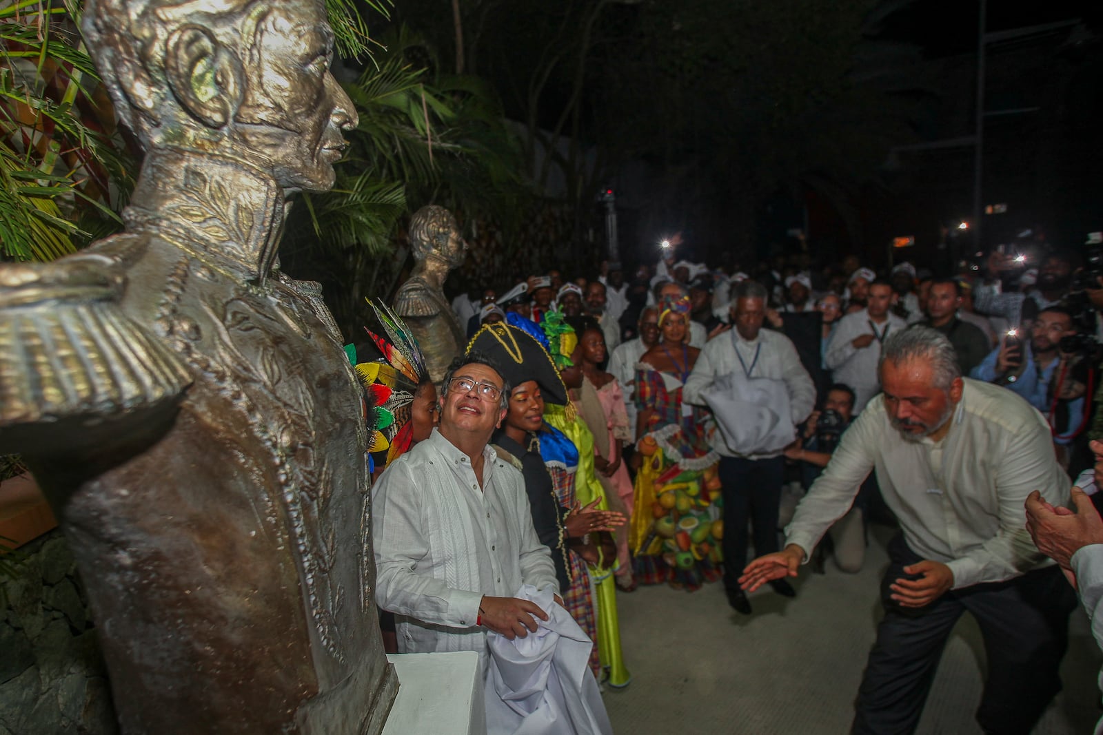 Colombia's President Gustavo Petro looks at a statue of Simon Bolivar in Jacmel, Haiti, Wednesday, Jan. 22, 2025. (AP Photo/Patrice Noel)