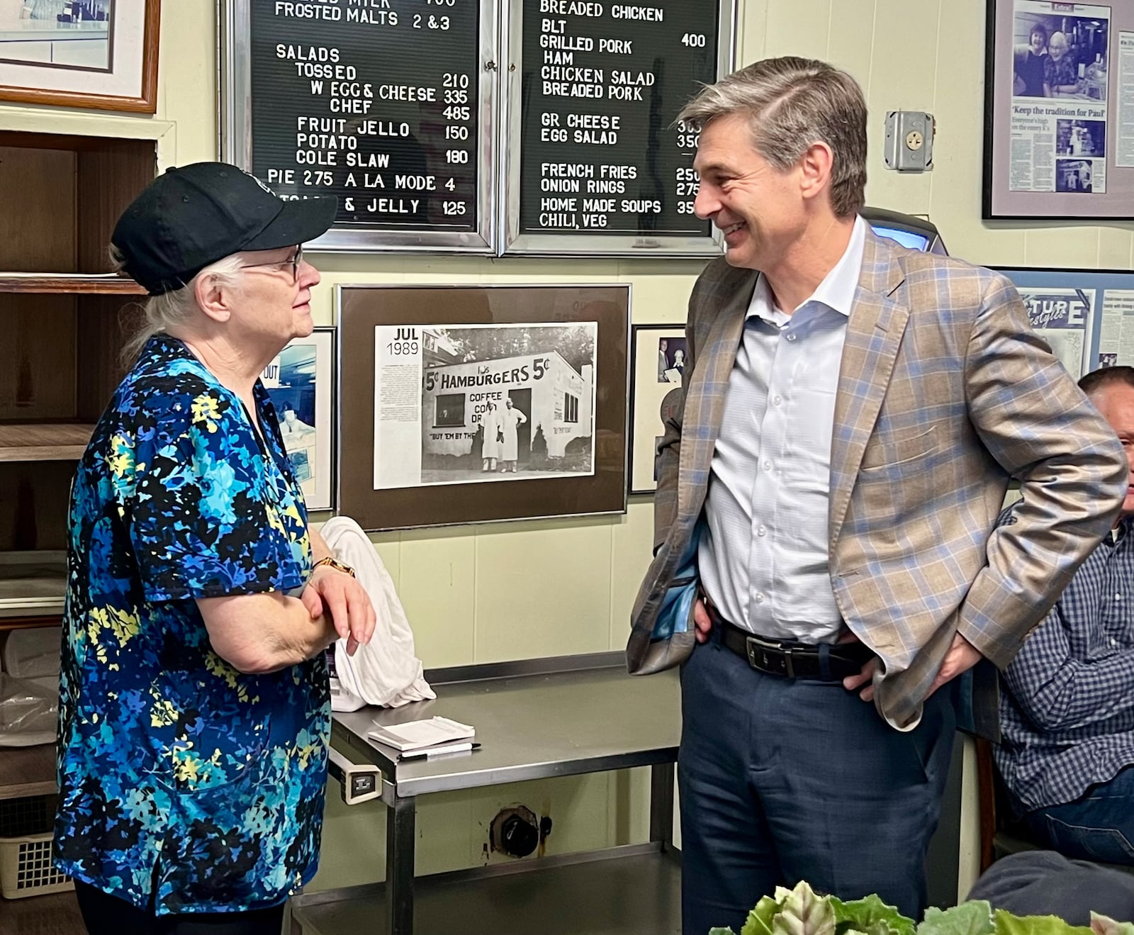 U.S. Senate candidate Matt Dolan spoke with the owner of K's Hamburgers, Marsha Klein-Ryan, in Troy on Saturday during a campaign stop at the restaurant. The 89-year-old restaurant is a Troy staple and has been a Midwest campaign stop for numerous Republican politicians throughout the years dating back to the 1970s. AIMEE HANCOCK/STAFF