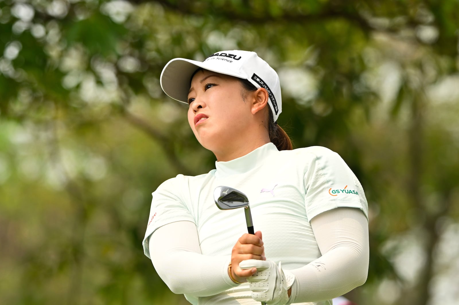 Mao Saigo of Japan watches her tee shot on the first hole of the LPGA Honda Thailand golf tournament in Pattaya, southern Thailand, Thursday, Feb. 20, 2025. (AP Photo/Kittinun Rodsupan)