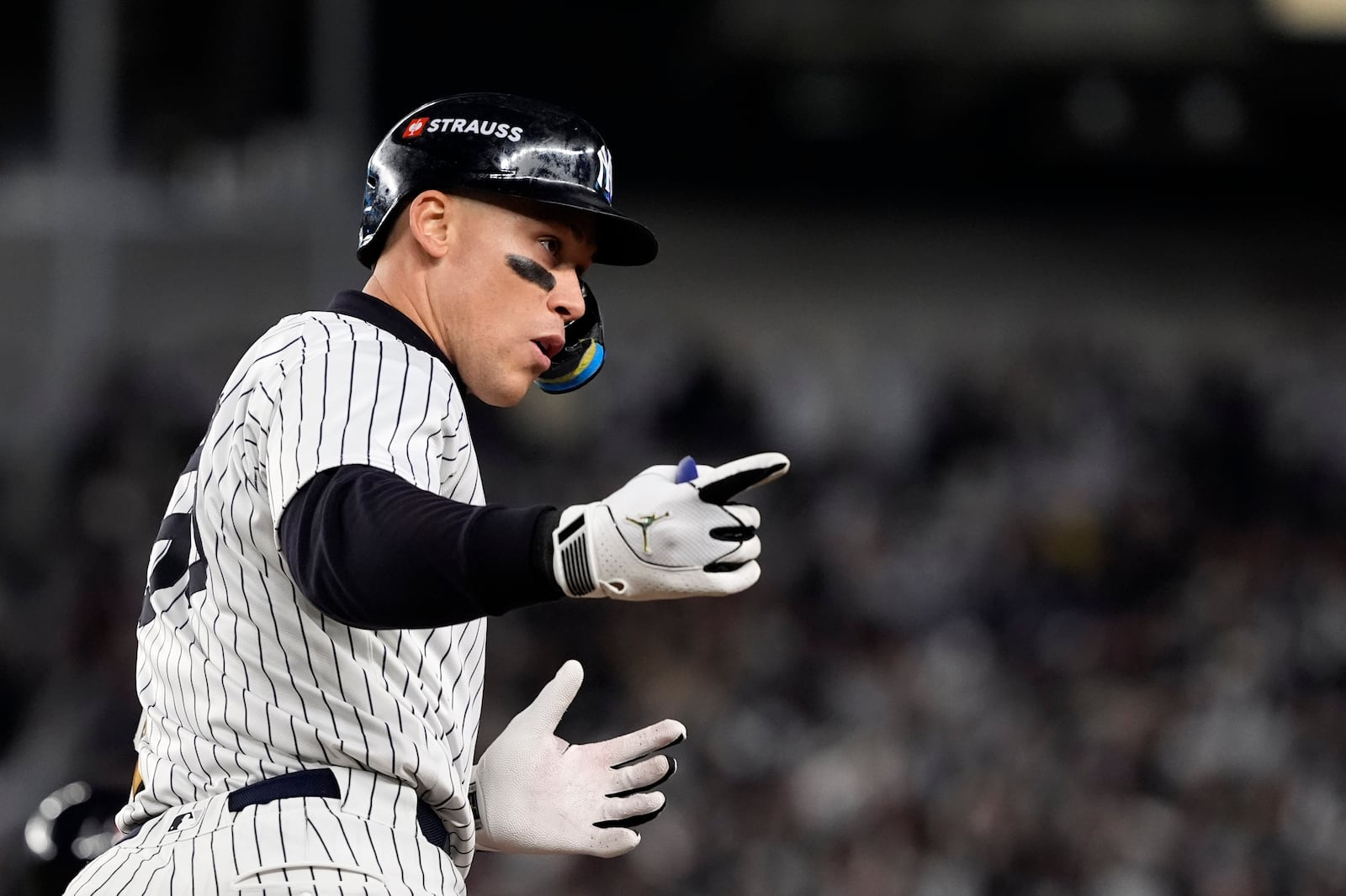 New York Yankees' Aaron Judge celebrates after hitting a two-run home run against the Cleveland Guardians during the seventh inning in Game 2 of the baseball AL Championship Series Tuesday, Oct. 15, 2024, in New York. (AP Photo/Godofredo Vásquez )