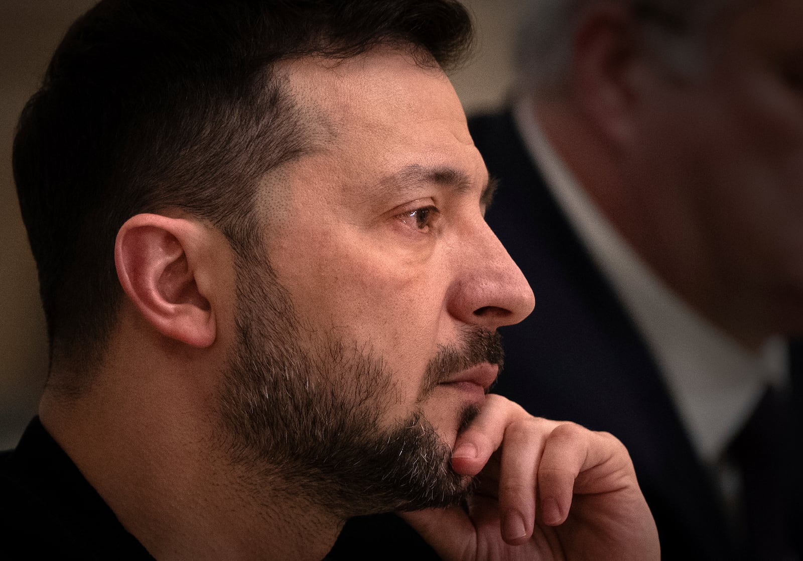 Ukrainian President Volodymyr Zelenskyy looks on during his meeting with Finland's Foreign Minister Elina Valtonen in Kyiv, Ukraine, Wednesday, Jan. 8, 2025. (AP Photo/Efrem Lukatsky)