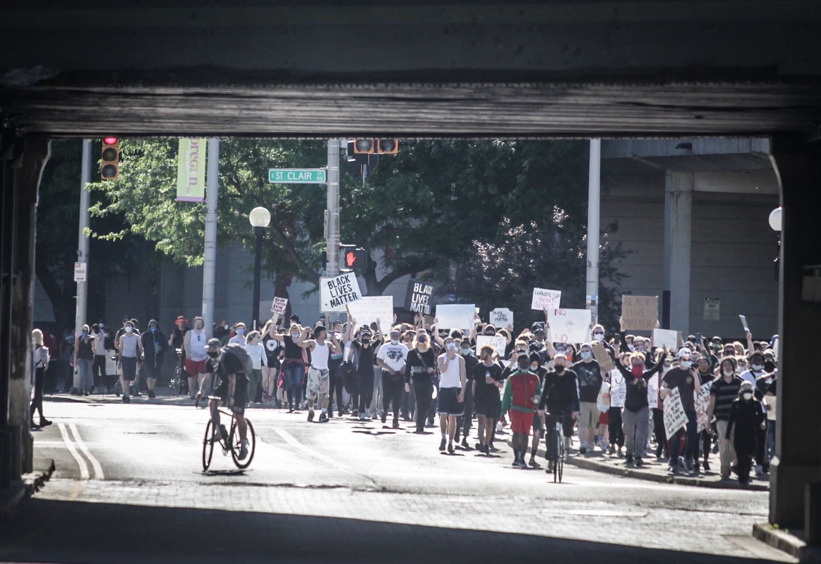 Protestors protest in the Oregon District on Sunday. JIM NOELKER / STAFF