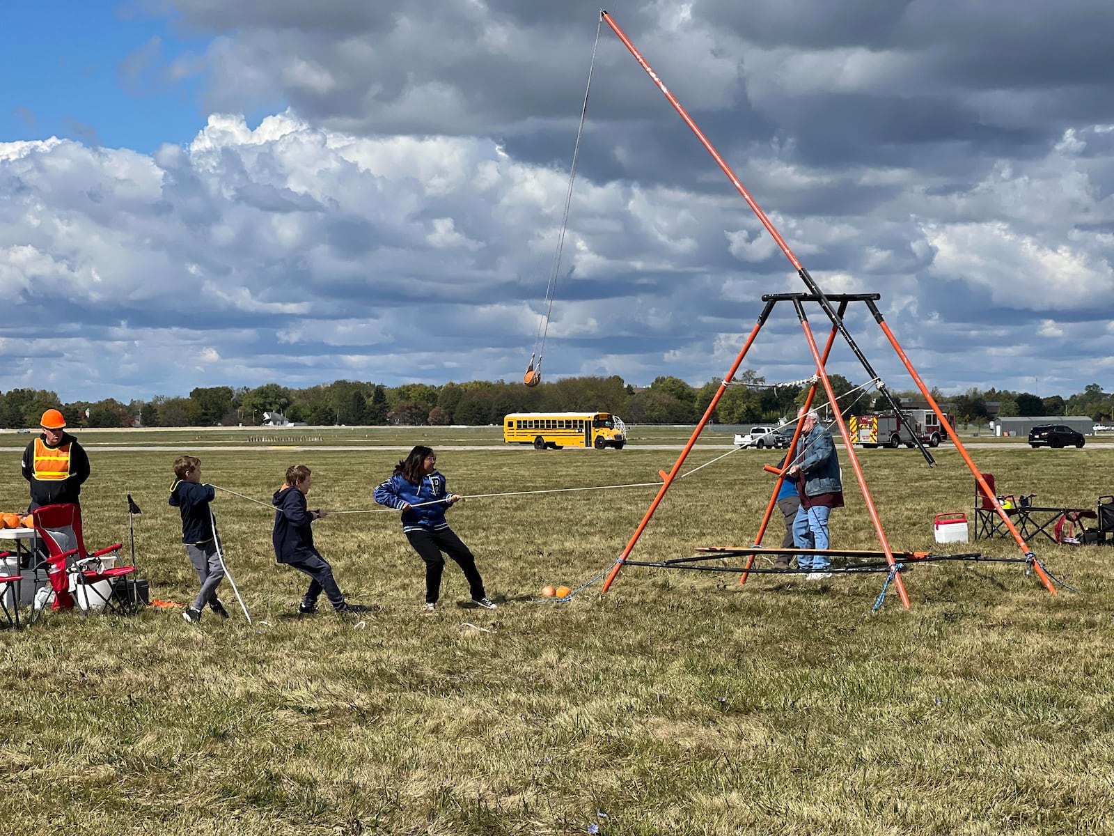 A novice team of young participants makes a valiant effort during Saturday's pumpkin chuck event. AIMEE HANCOCK/STAFF