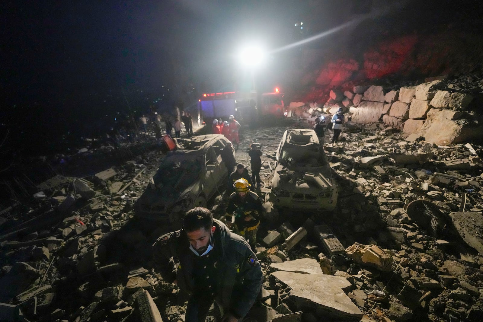 FILE - Rescuers search for survivors after an Israeli airstrike in Baalchmay village east of Beirut, Lebanon, on Nov. 12, 2024. (AP Photo/Hassan Ammar, File)