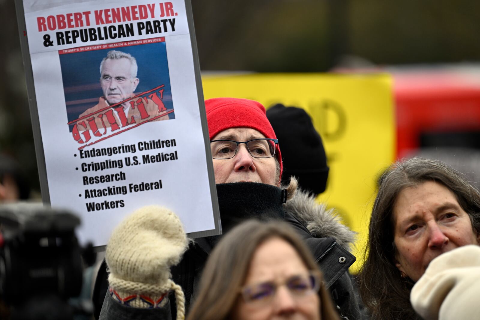 People rally at Health and Human Services headquarters to protest the polices of President Donald Trump and Elon Musk Wednesday, Feb. 19, 2025, in Washington. (AP Photo/John McDonnell)