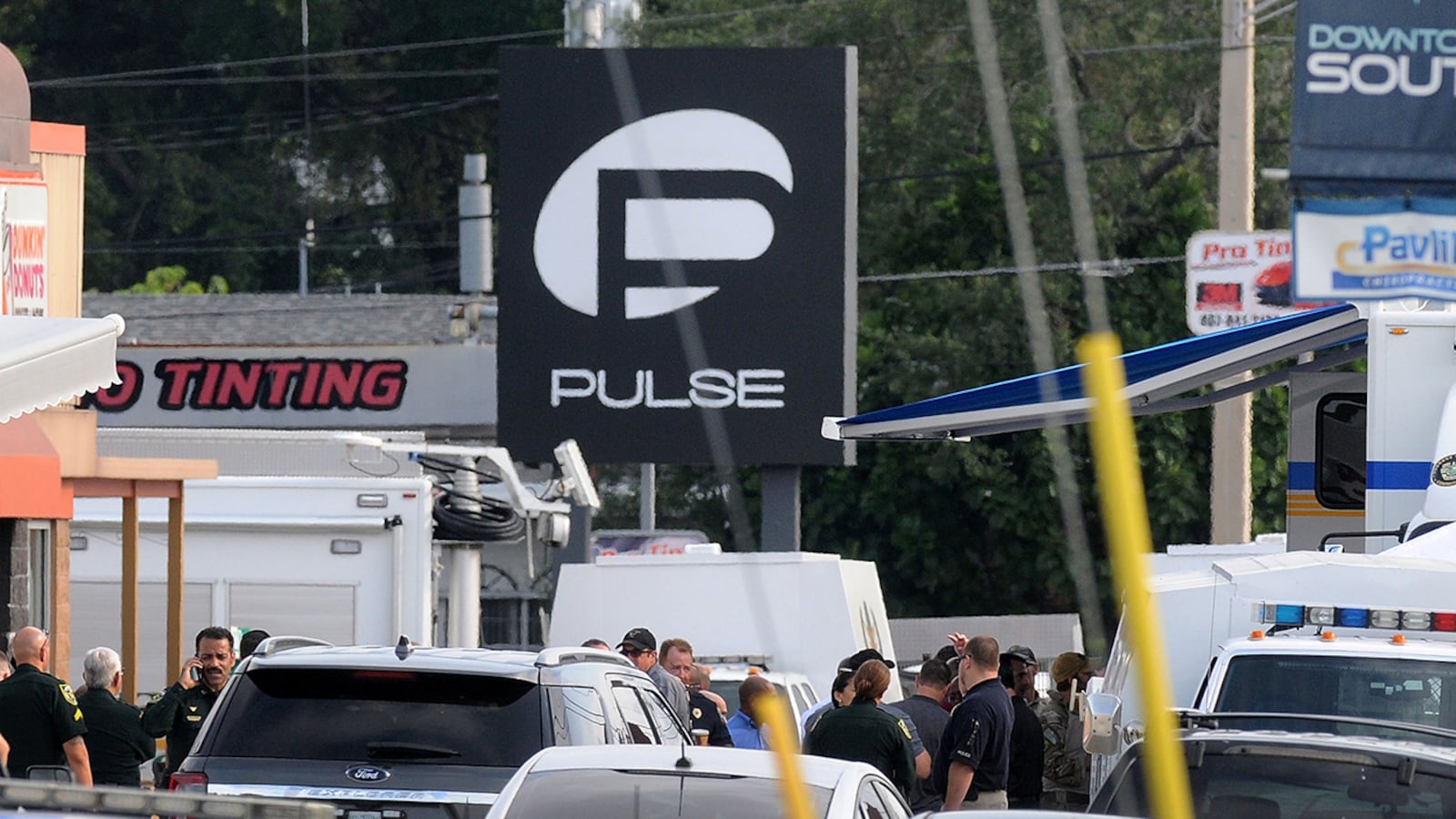 Orlando police officers outside of Pulse nightclub after a fatal shooting and hostage situation on June 12, 2016.  20 people died and 42 were injured. (Photo by Gerardo Mora/Getty Images)