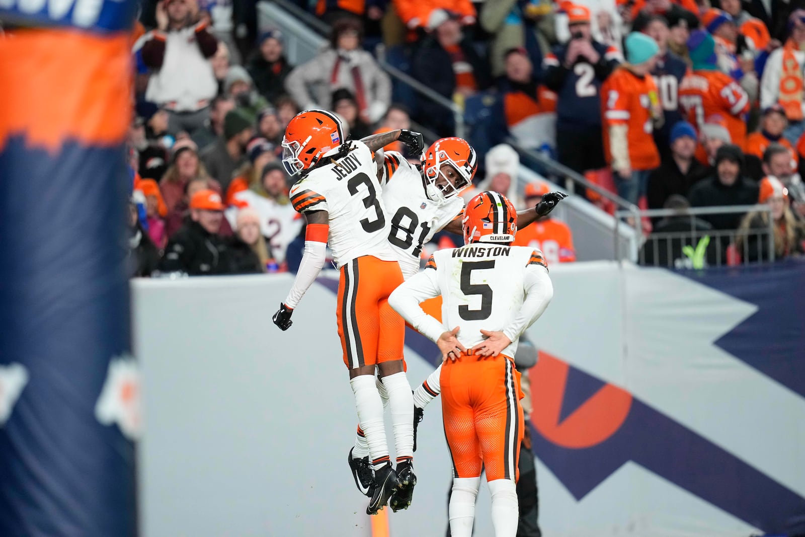 Cleveland Browns wide receiver Jerry Jeudy (3) celebrates his 70-yard pass reception for a touchdown with wide receiver Michael Woods II (81) during the second half of an NFL football game against the Denver Broncos, Monday, Dec. 2, 2024, in Denver. (AP Photo/Jack Dempsey)