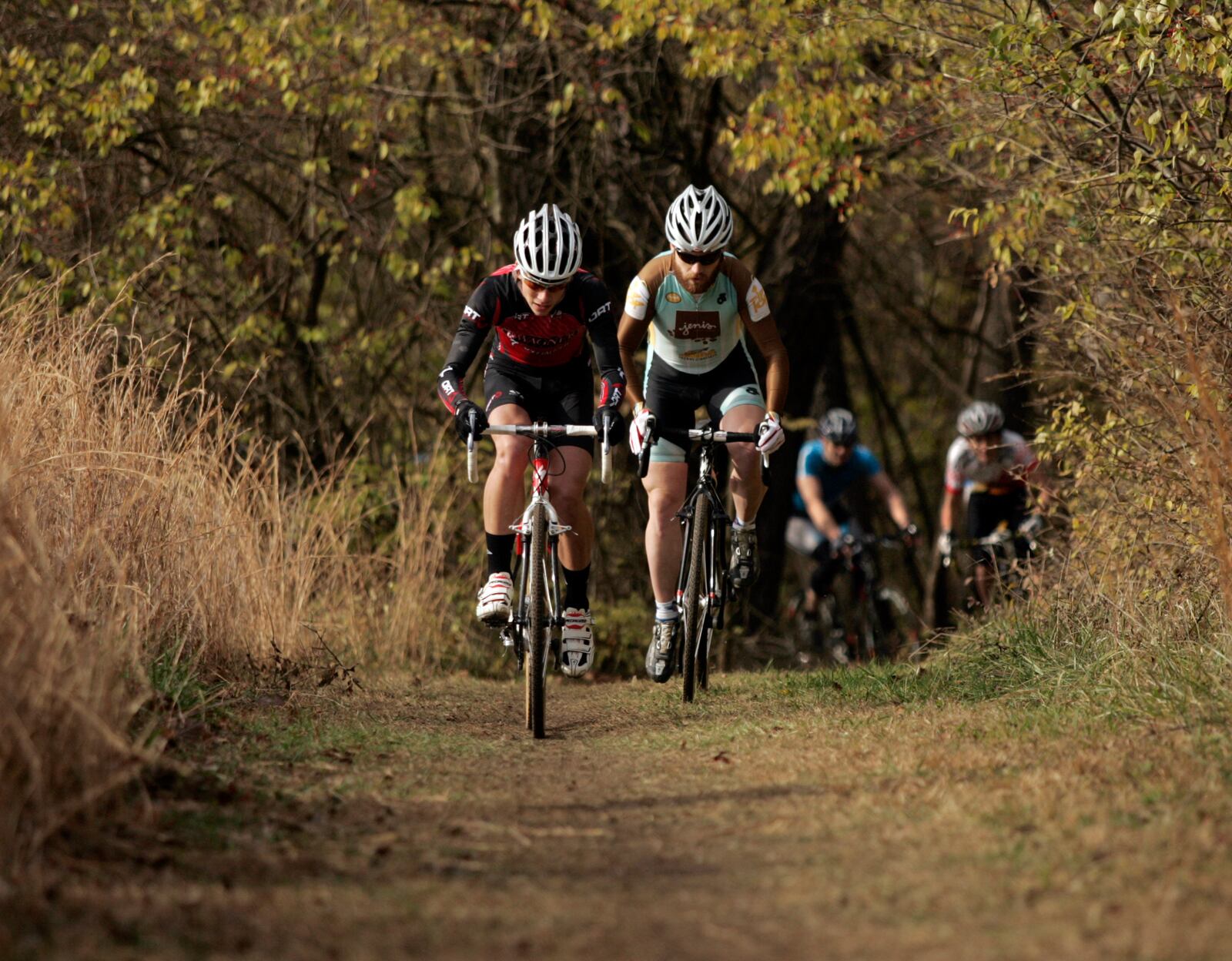 Bicycle racers emerge from a wooded area during a past race at John Bryan State Park near Yellow Springs. Staff file photo/Jim Witmer