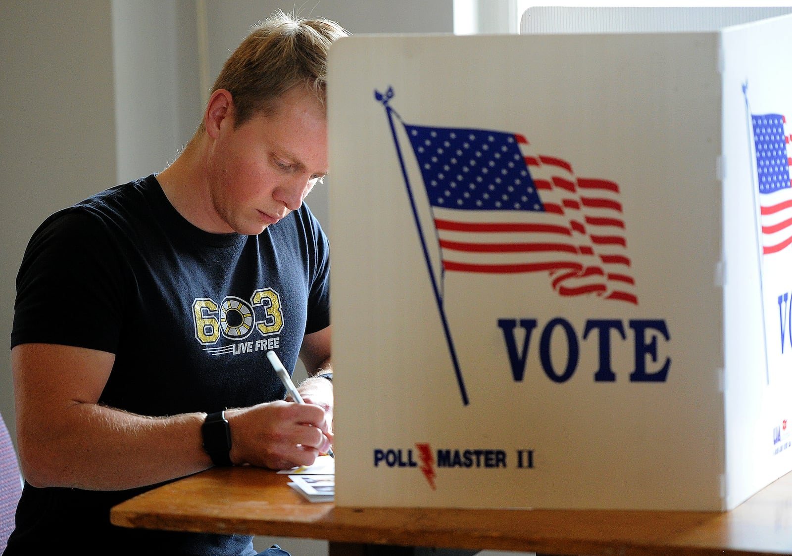 Nicholas Langenderfer votes Tuesday, Nov. 7, 2023 at the Masonic Center in Dayton.  MARSHALL GORBY \STAFF