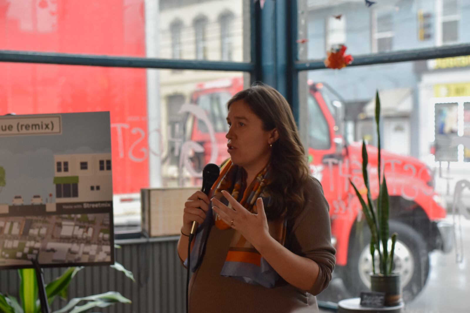 Laura Estandia, a member of the Wayne Avenue Traffic Safety Coalition, speaks at Ghostlight Coffee on Wayne Avenue on Jan. 24, 2024. CORNELIUS FROLIK / STAFF