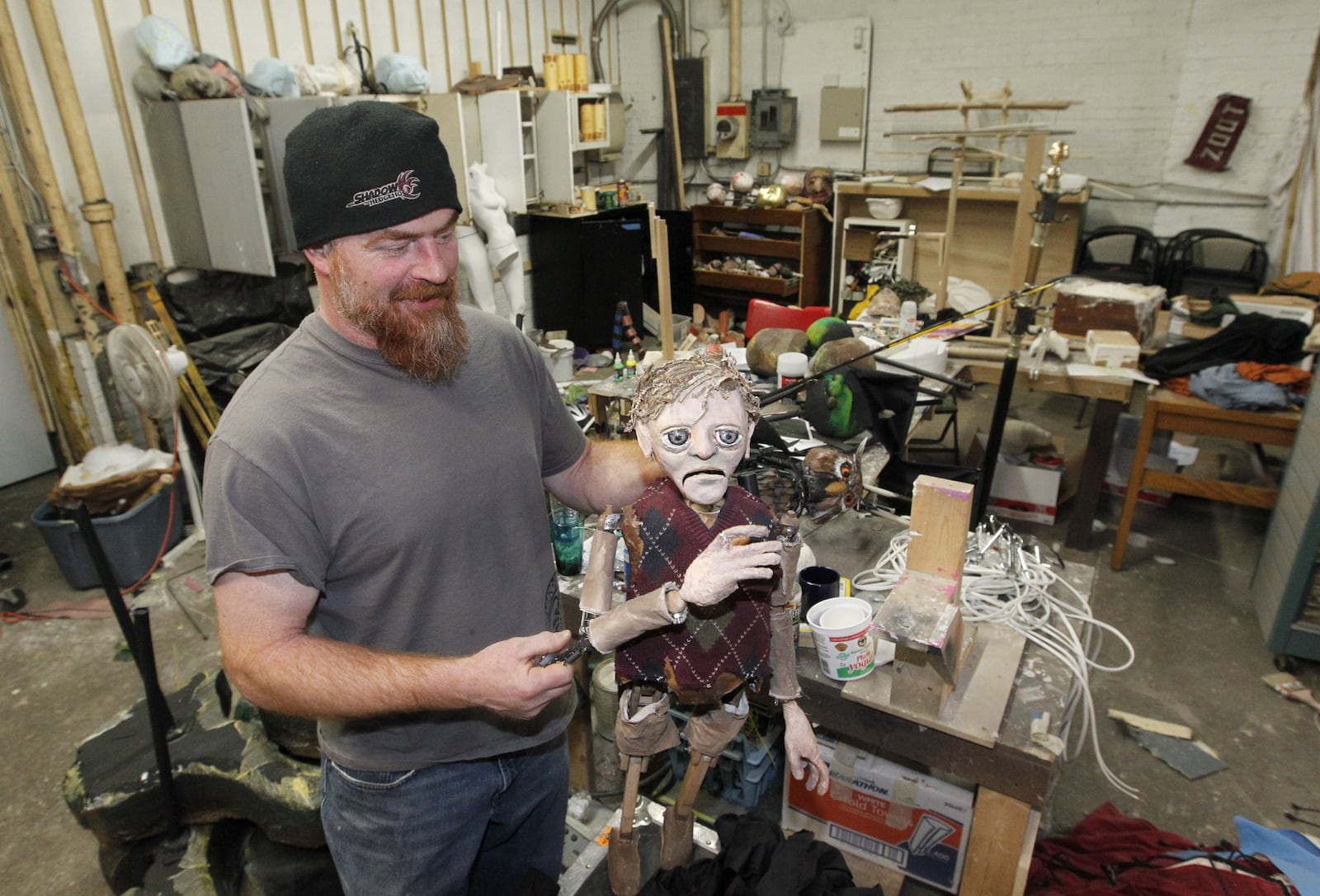 Tristan Cupp, artistic director for Zoot Theatre Co., works and rehearses in a studio overflowing with puppet parts and materials. The company is using Power2Give, a new online website that allows arts groups to fund raise for specific projects, to raise money for shelving and storage. LISA POWELL / STAFF