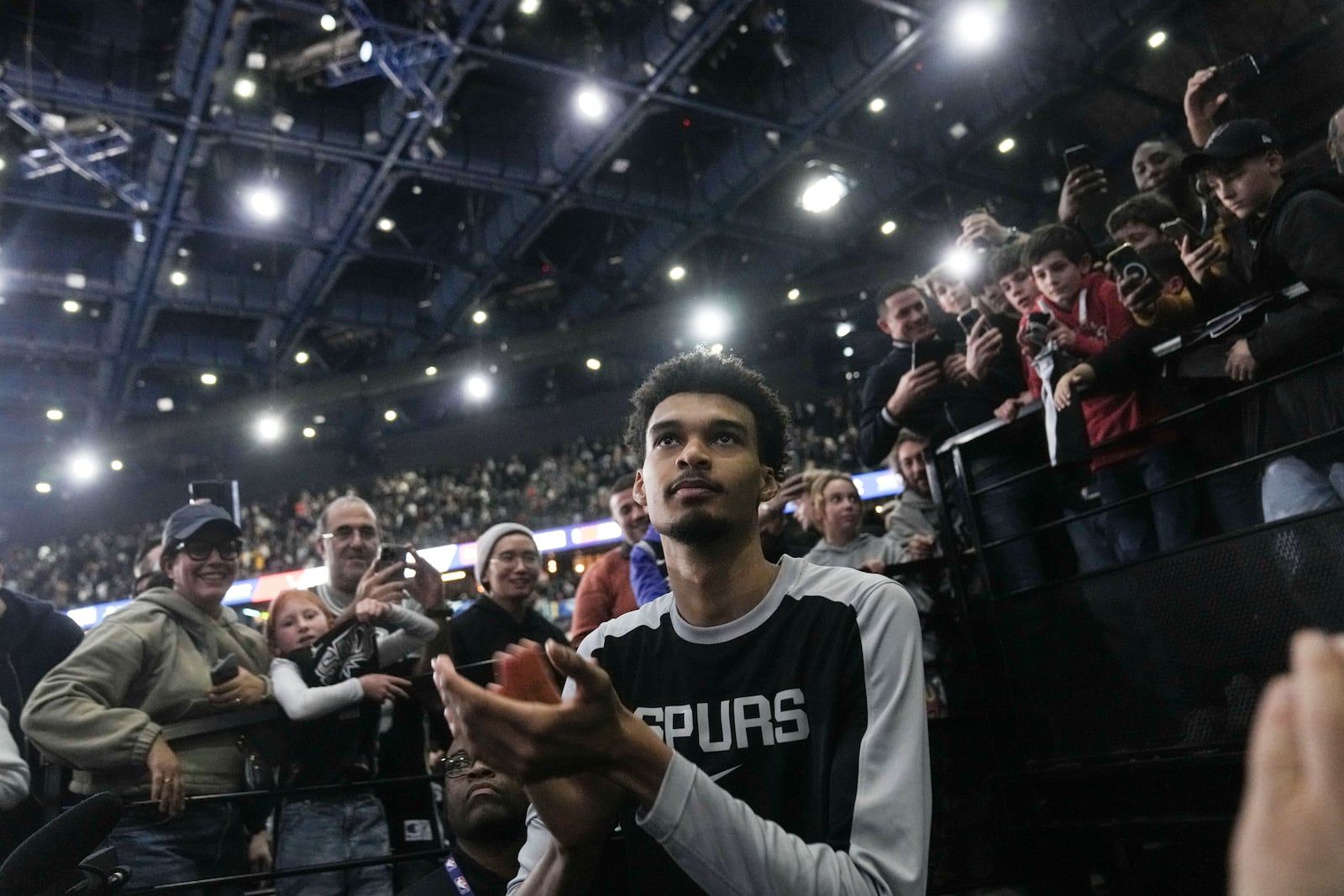 San Antonio Spurs center Victor Wembanyama (1) claps following a Paris Games 2025 NBA basketball game against the Indiana Pacers in Paris, Saturday, Jan. 25, 2025. (AP Photo/Thibault Camus)