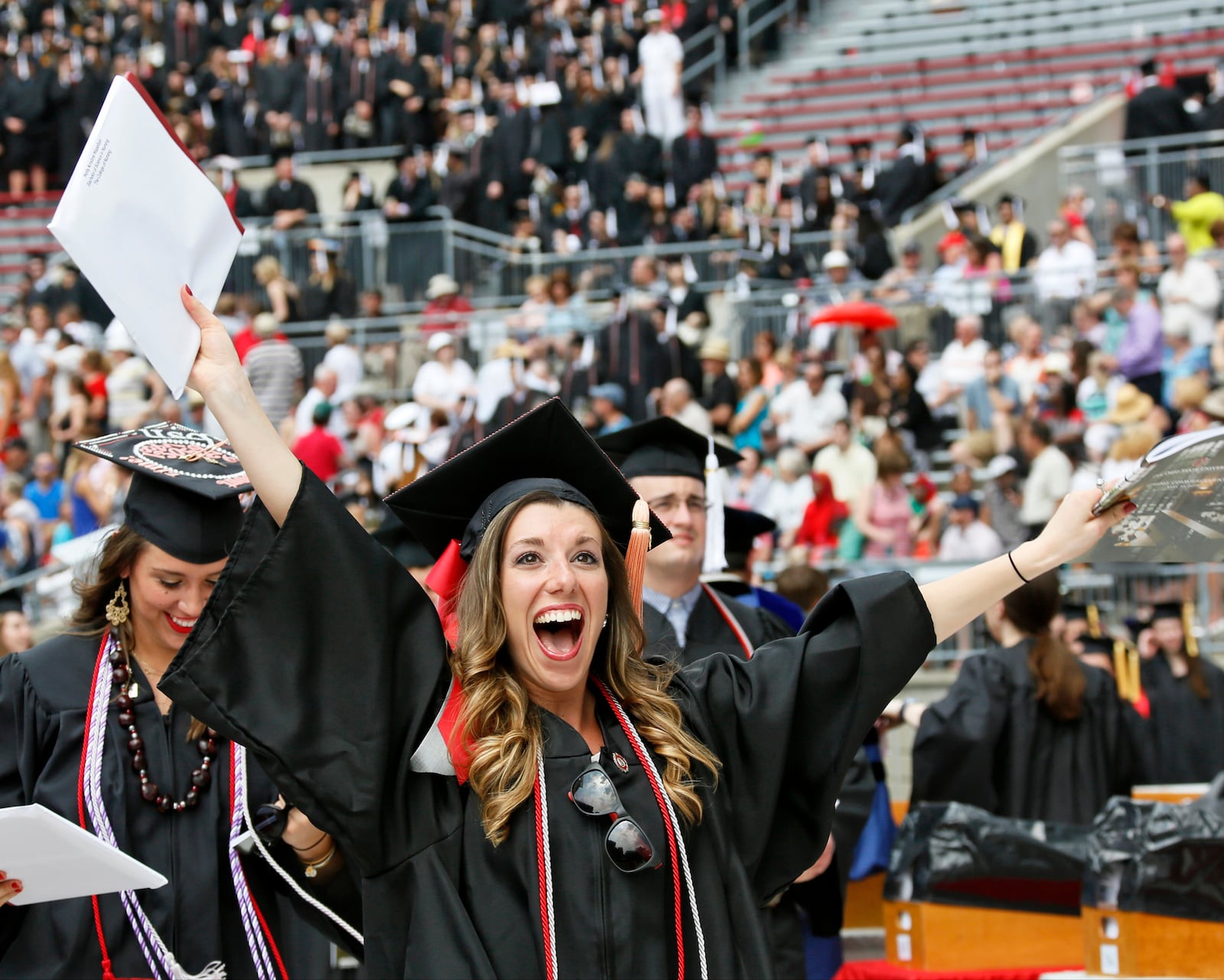 Holly Hazelton celebrates receiving her degree in Nursing as Ohio State University held commencement exercises for around 10,000 graduates on Sunday, May 10, 2015 at Ohio Stadium. (Dispatch Photo by Barbara J. Perenic)