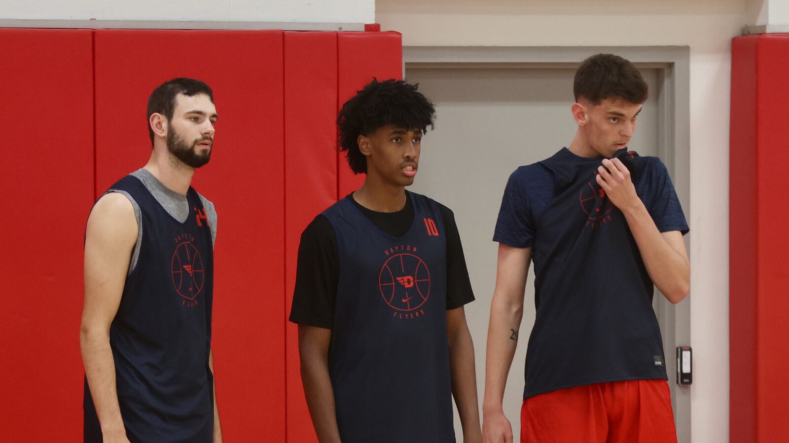 Dayton's Jacob Conner, Hamad Mousa and Amaël L'Etang watch a drill during a preseason practice on Wednesday, Oct. 2, 2024, at the Cronin Center. David Jablonski/Staff