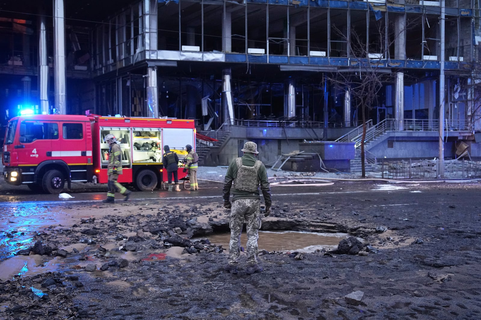 First responders work the scene following a Russian missile attack in Kyiv, Ukraine, Saturday, Jan. 18, 2025. (AP Photo/Efrem Lukatsky)