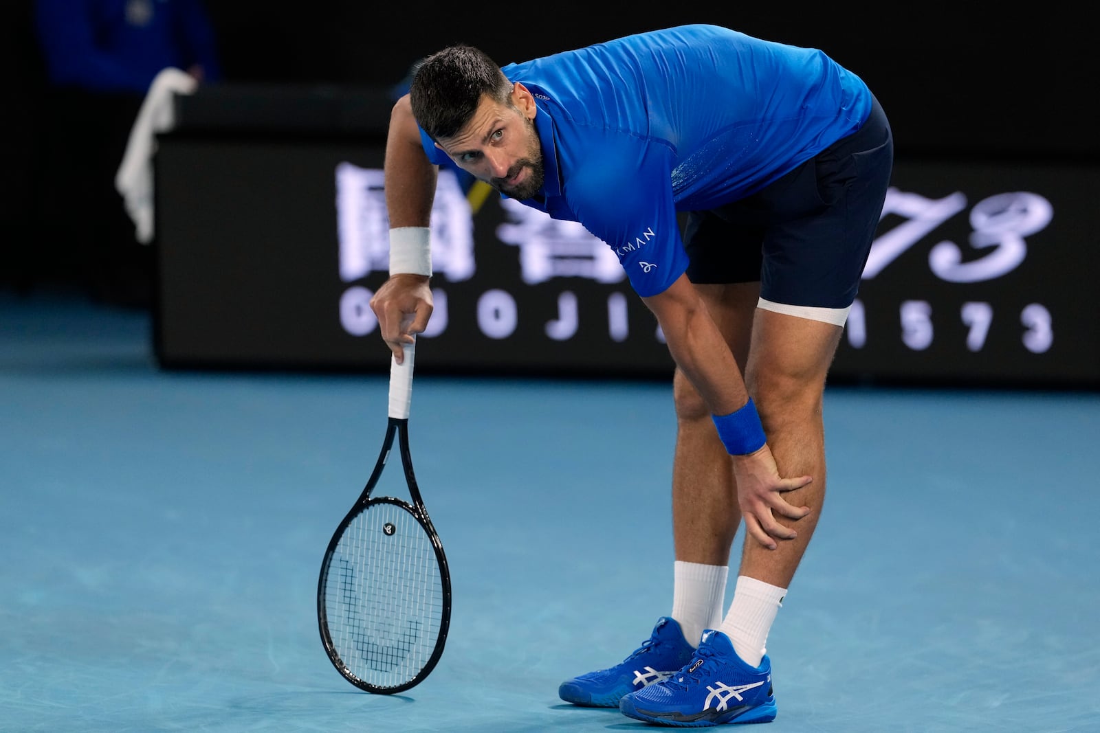 Novak Djokovic of Serbia reacts during his quarterfinal match against Carlos Alcaraz of Spain at the Australian Open tennis championship in Melbourne, Australia, Wednesday, Jan. 22, 2025. (AP Photo/Asanka Brendon Ratnayake)