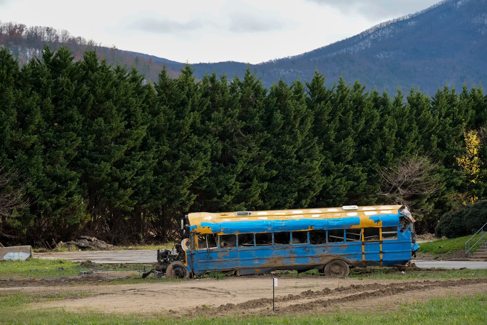 A damaged bus used for transporting whitewater rafters is seen Friday, Nov. 22, 2024, in Erwin, Tenn. (AP Photo/George Walker IV)