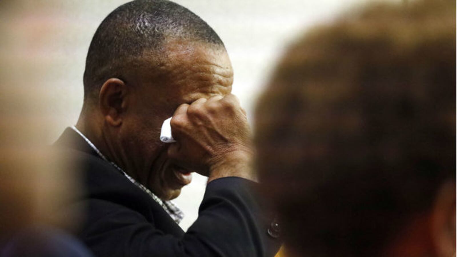 Bertram Jean, father of Botham Jean, wipes tears from his eyes Friday, Sept. 27, 2019, during the testimony of Amber Guyger, the former Dallas police officer who fatally shot his son Sept.6, 2018. Guyger is on trial for murder.