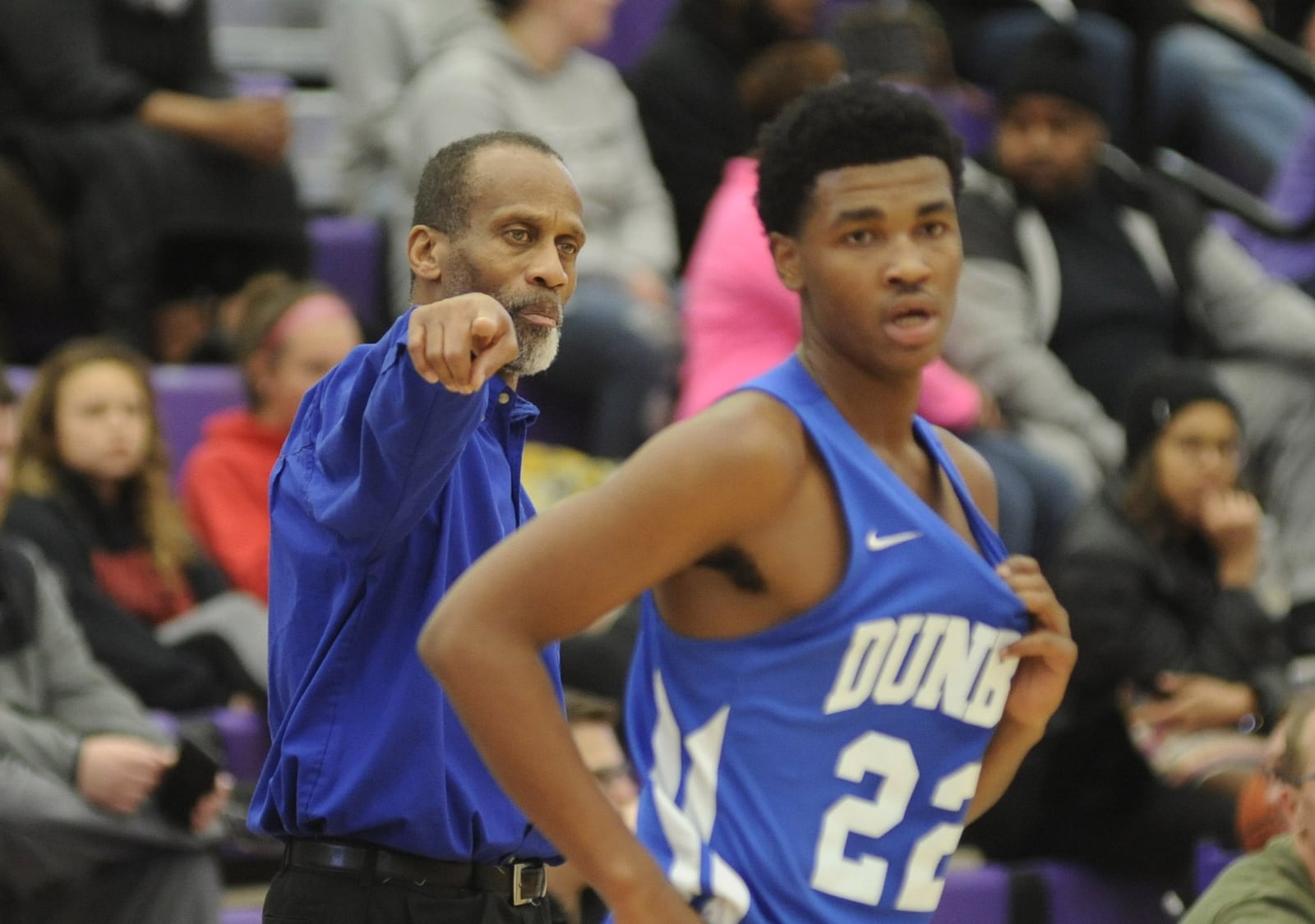 Lyle Cole (left) is charged with pointing Dunbar in the right direction, including Jse’veaughn Minor. Middletown defeated visiting Dunbar 60-28 in a boys high school basketball game on Tuesday, Dec. 4, 2018. MARC PENDLETON / STAFF