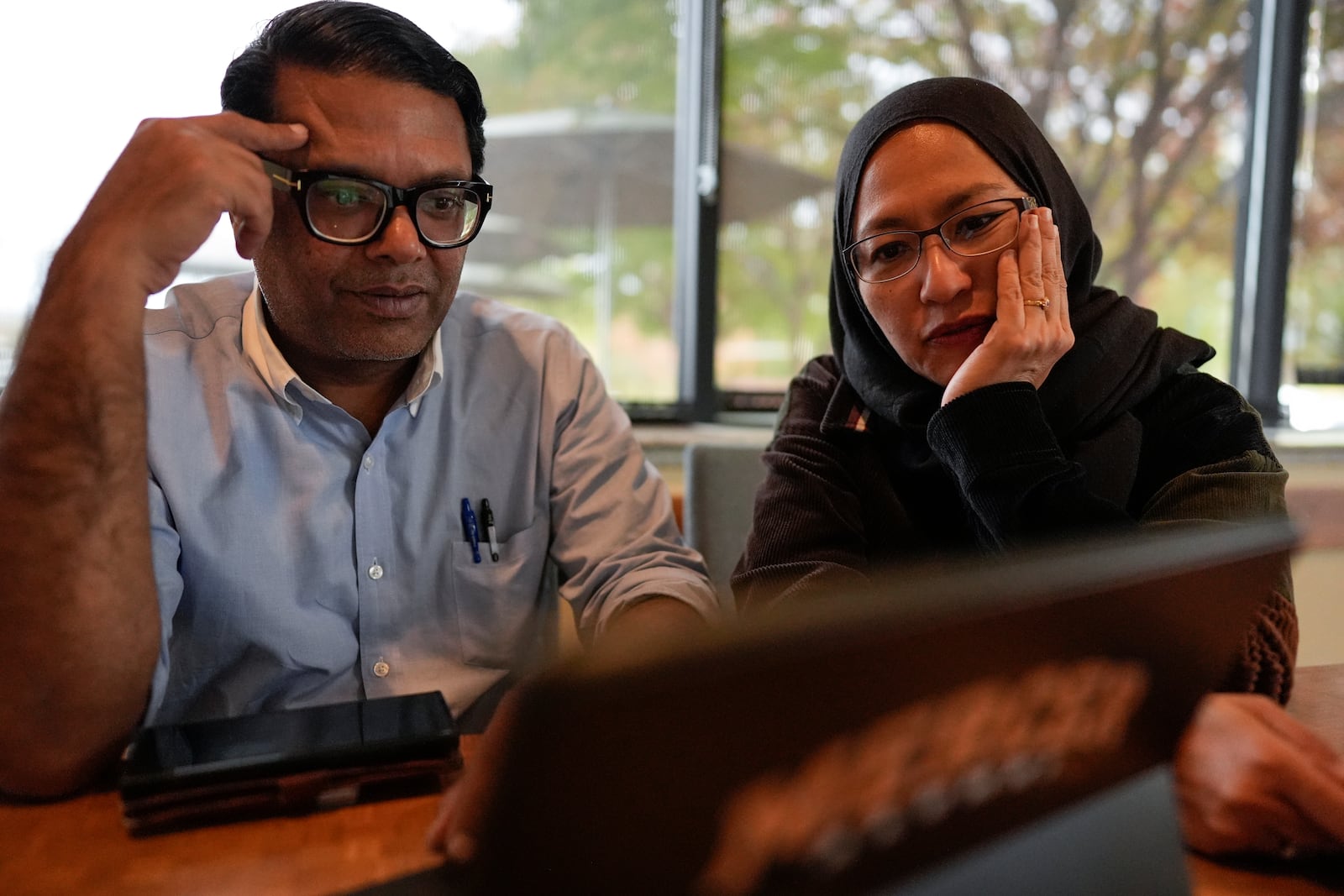 Soraya Burhani, right, works with Georgia Rep. Farooq Mughal, Wednesday, Oct. 30, 2024, in Buford, Ga. (AP Photo/Mike Stewart)